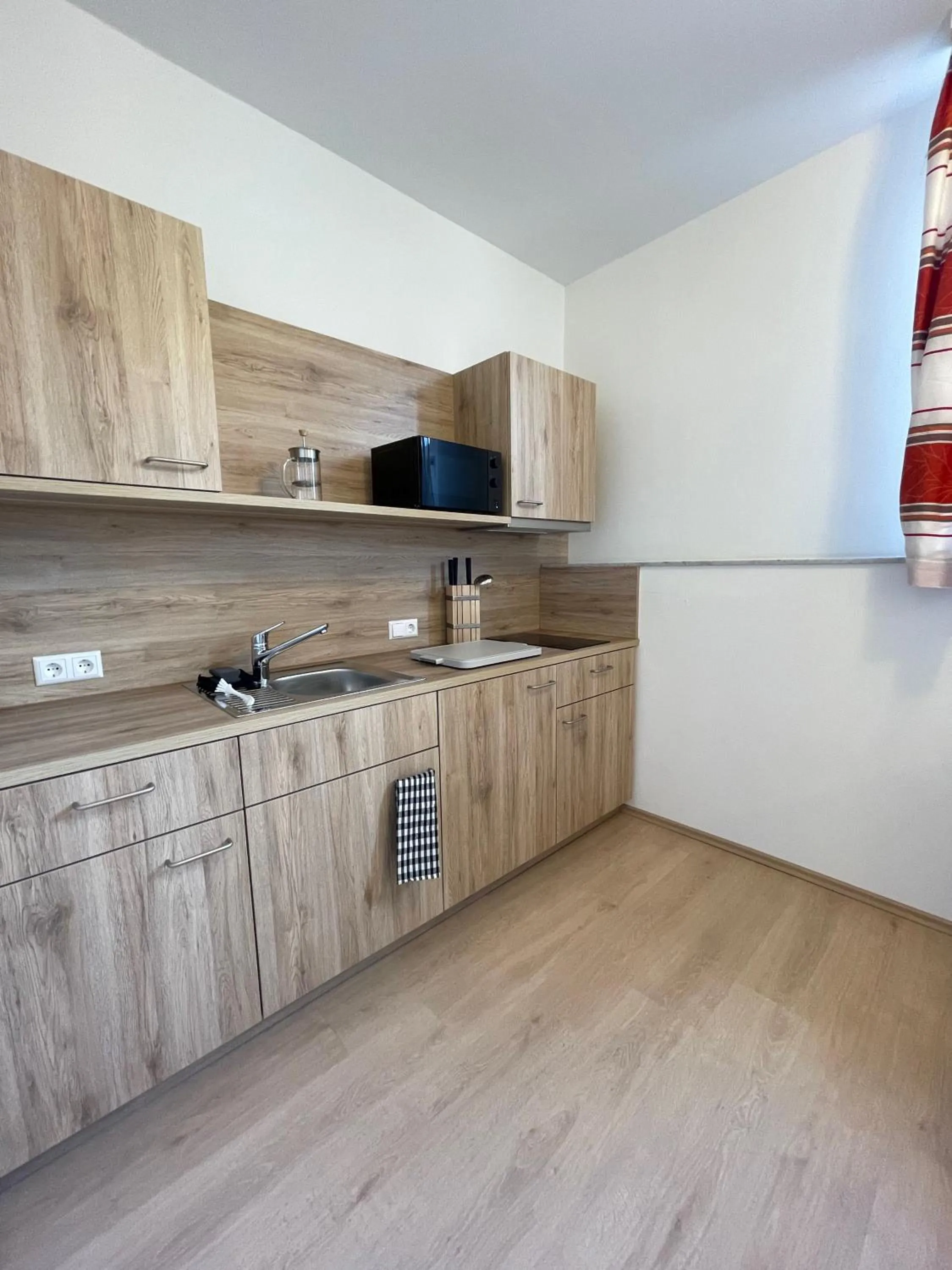 Kitchen or kitchenette in Hotel am Römerplatz