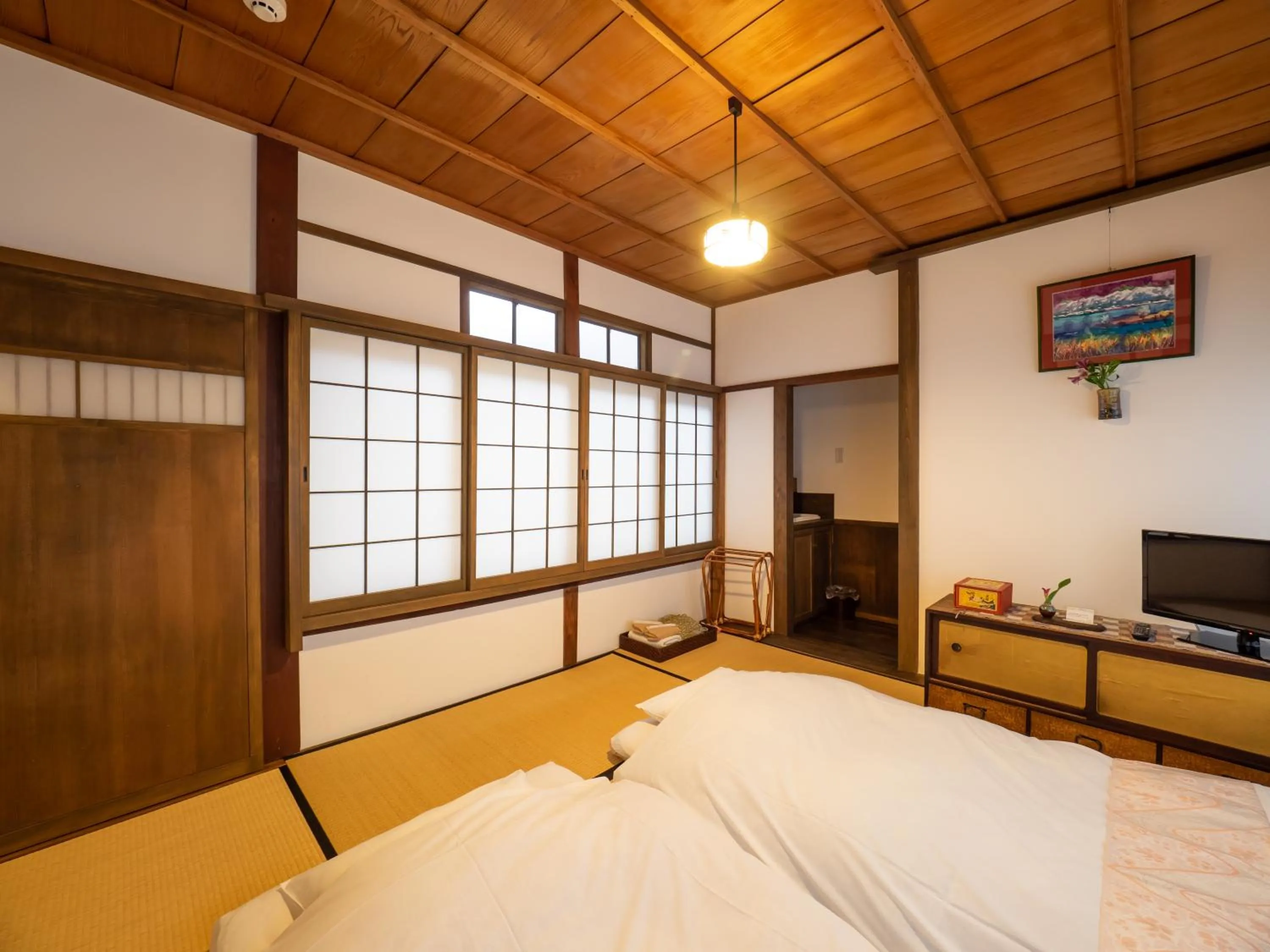 Bed in Inase Otsu Machiya Bed and Breakfast