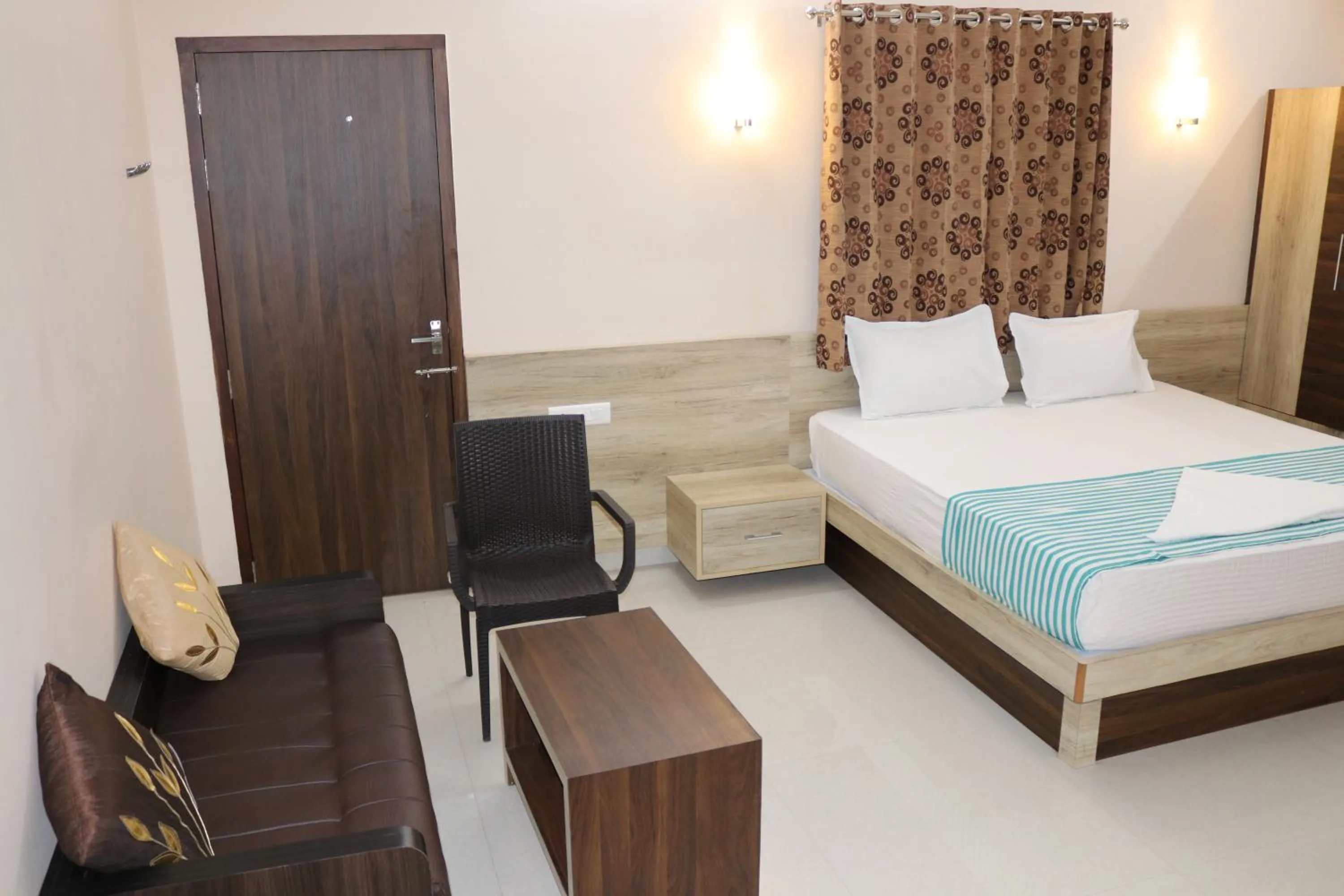 Photo of the whole room, Bed in Jeyam Residency