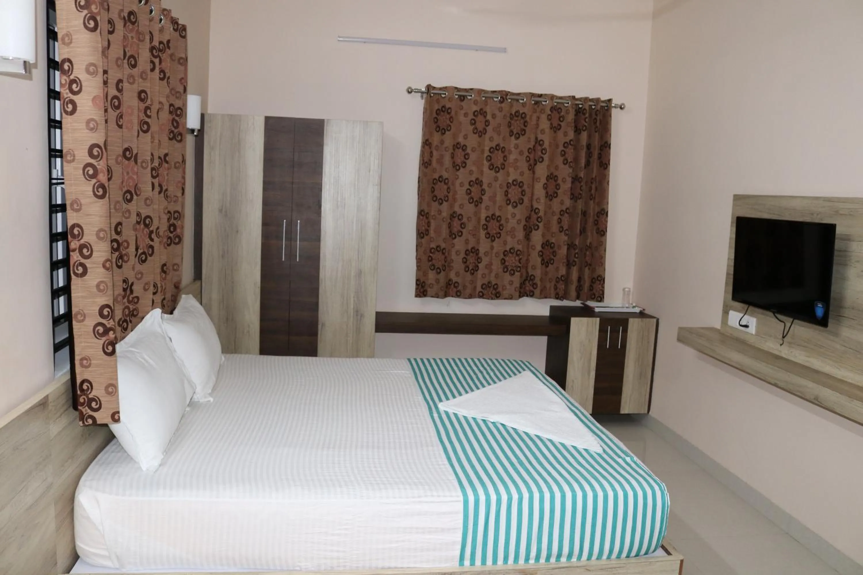 Photo of the whole room, Bed in Jeyam Residency