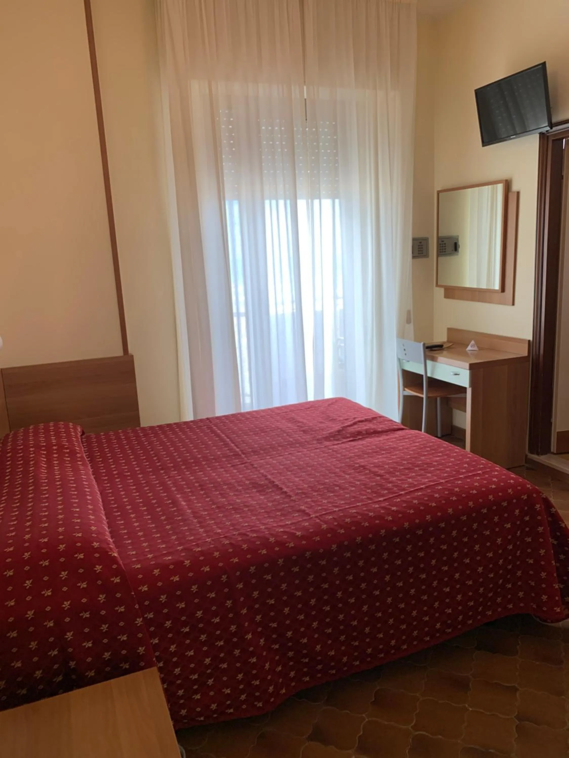 Bed in Hotel Flamingo