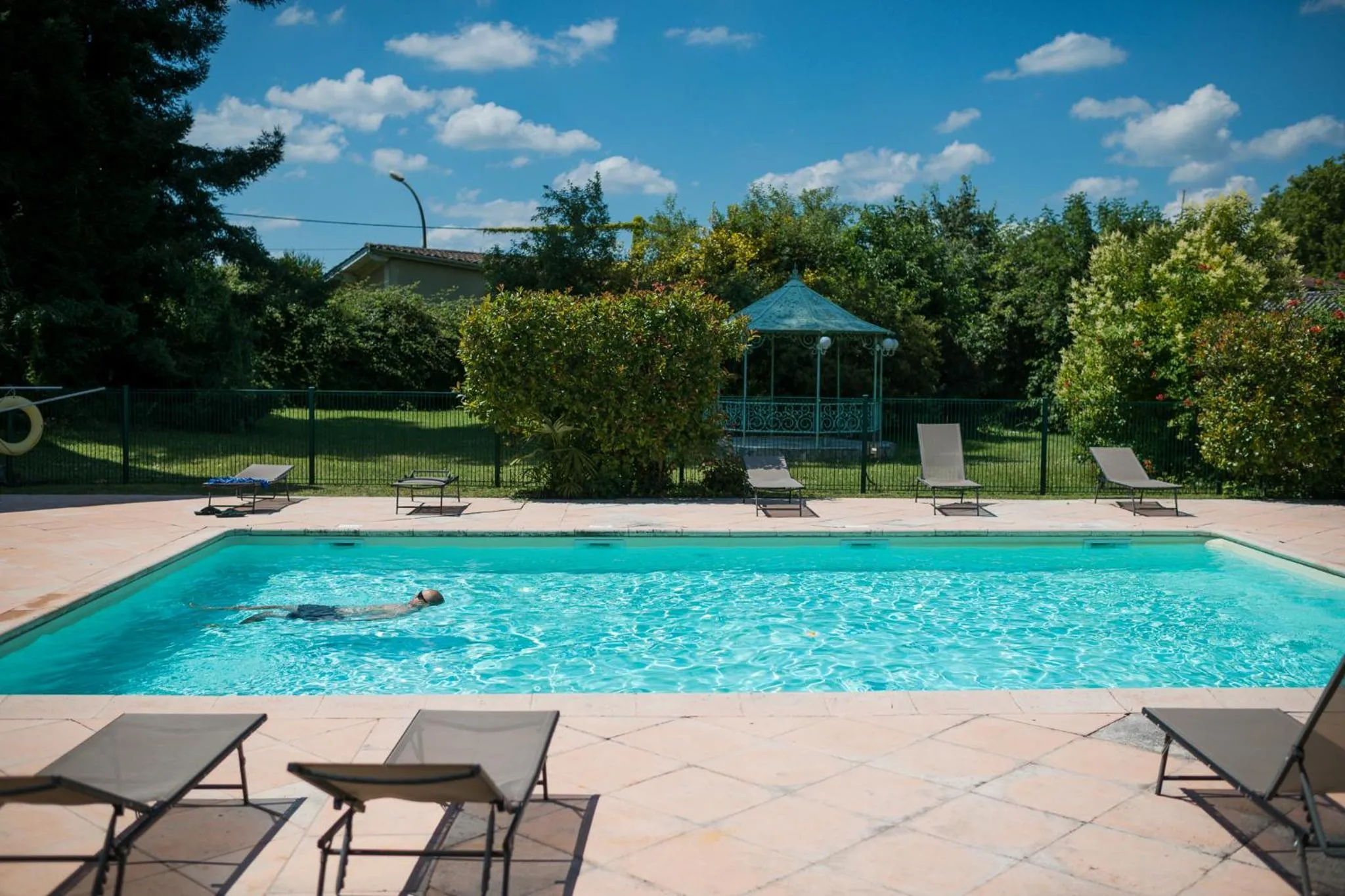 Swimming pool in Logis Hôtels- Hôtel et Restaurant Domaine de Fompeyre