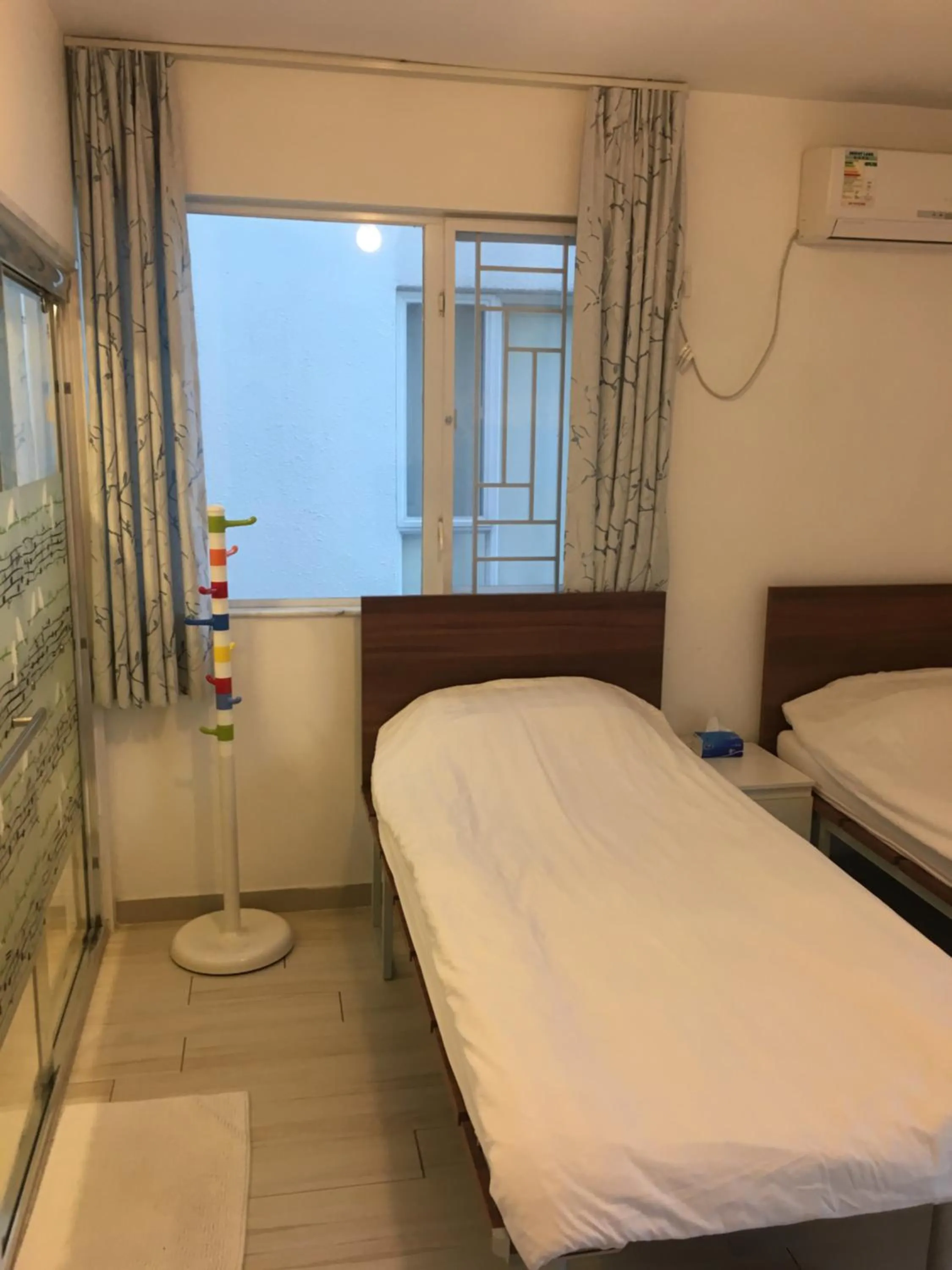 Bed in City Oasis Guesthouse