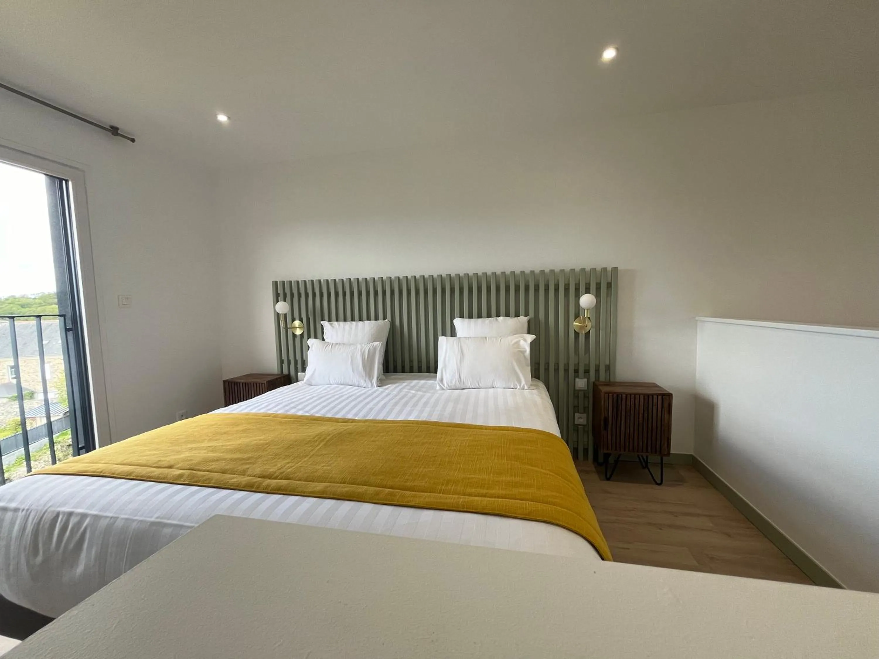 Bed in Hotel du Trégor