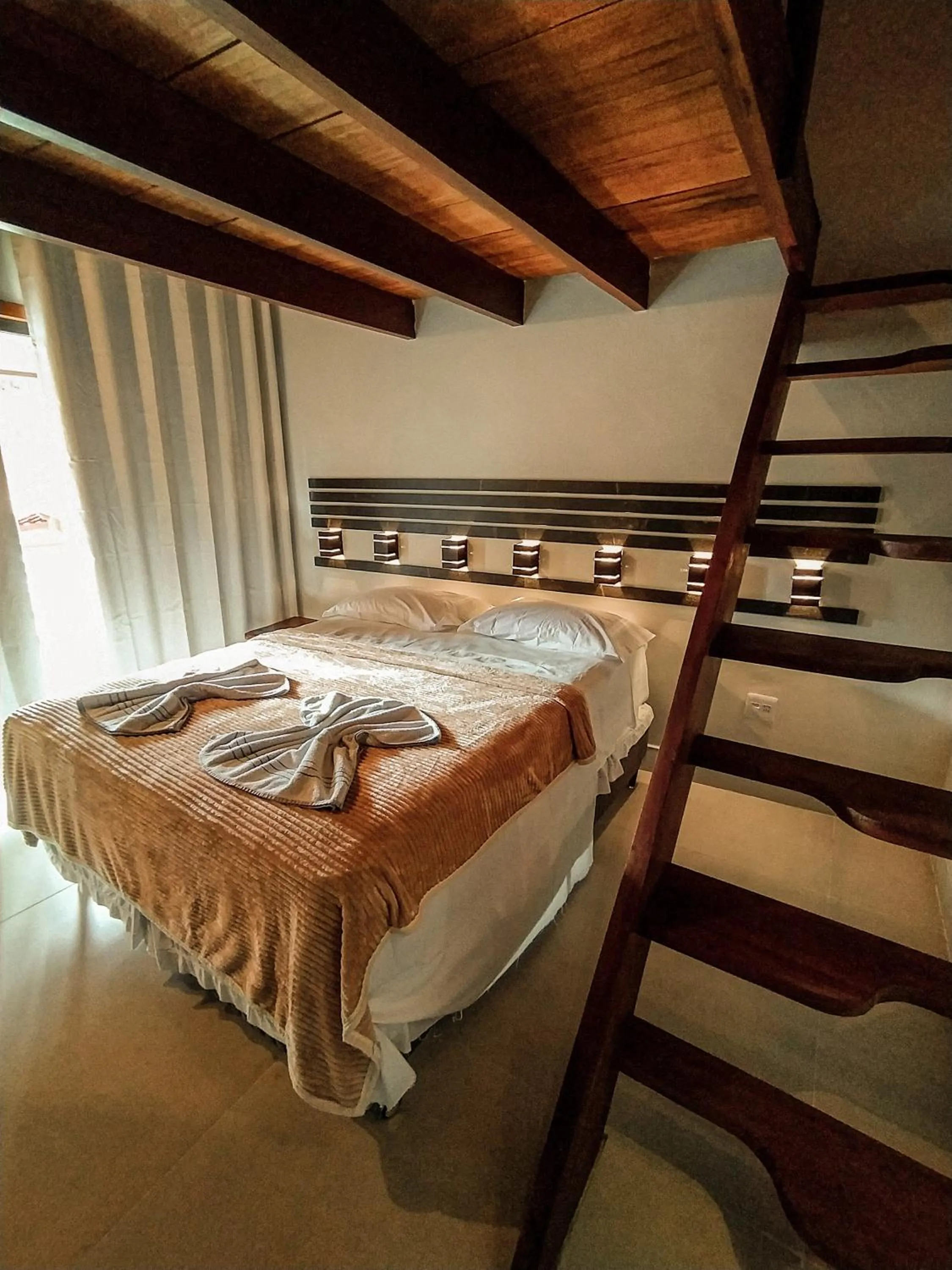 Bed in Pousada Recanto da Concha