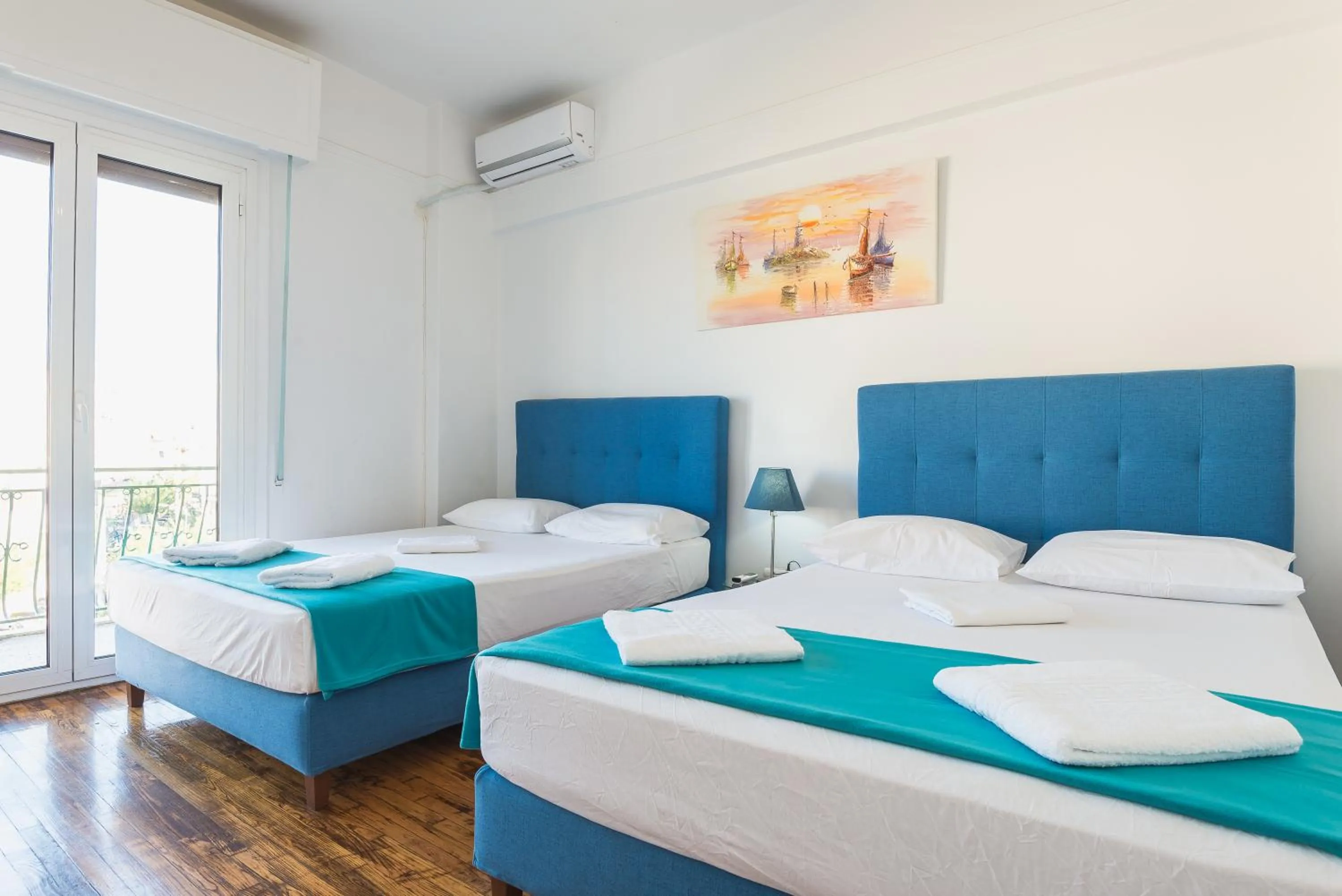 Bed in Super Paradise Apartments