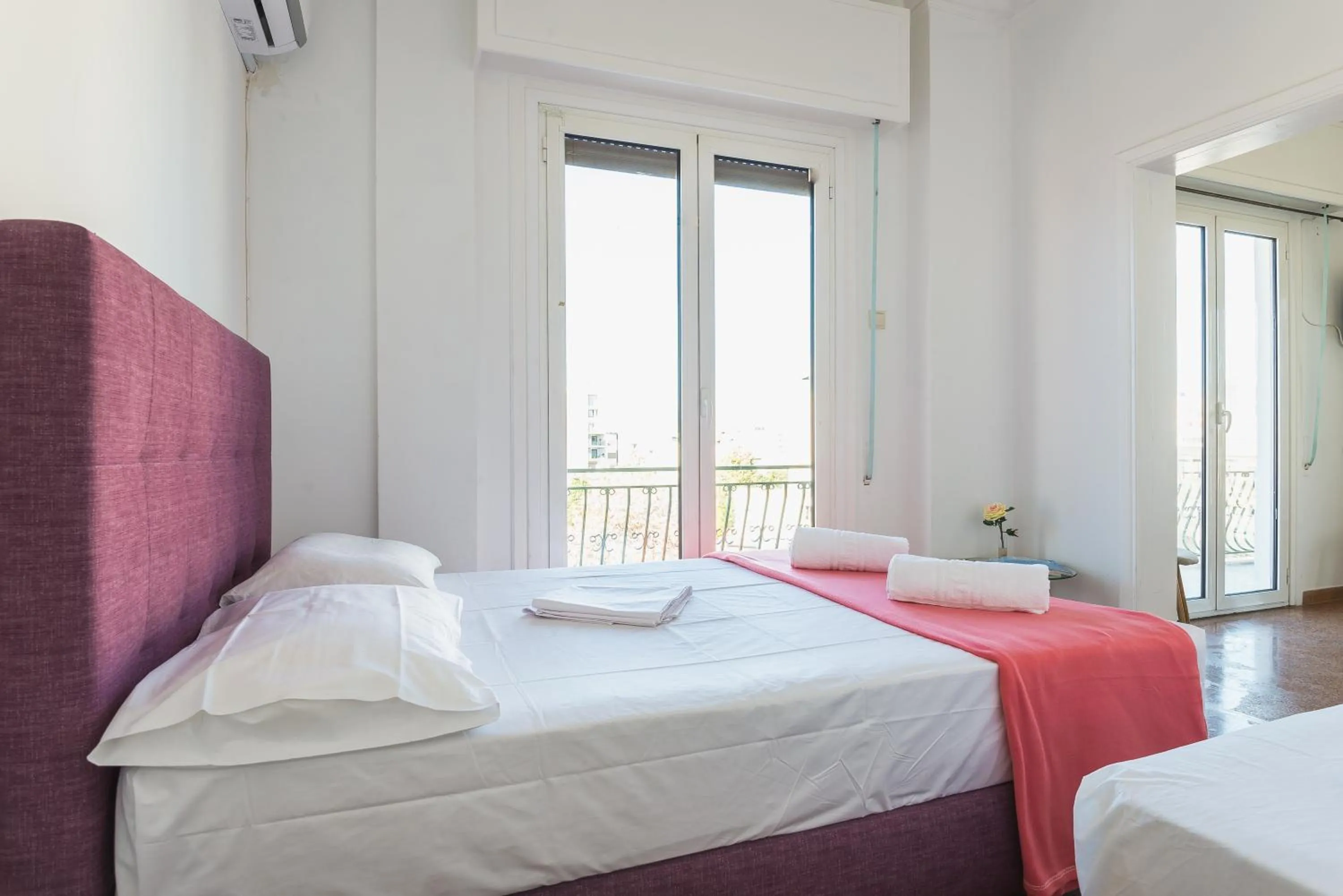 Bed in Super Paradise Apartments