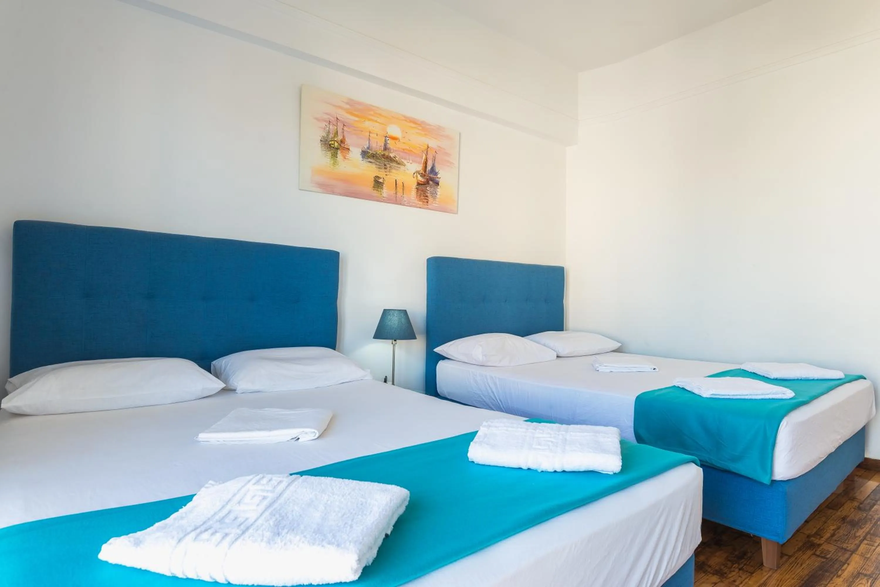 Bed in Super Paradise Apartments