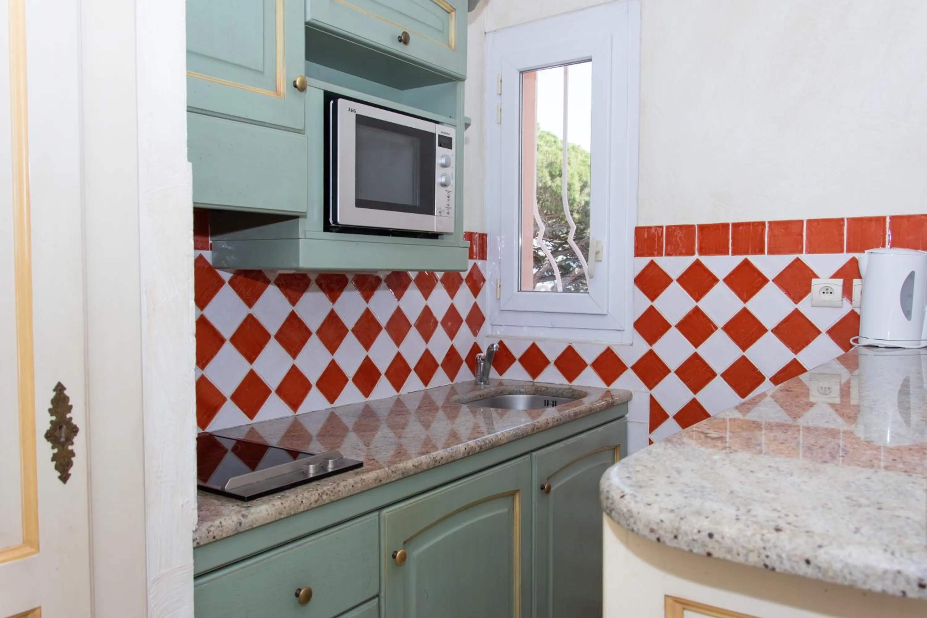 Kitchen or kitchenette in Hôtel & Spa La Villa