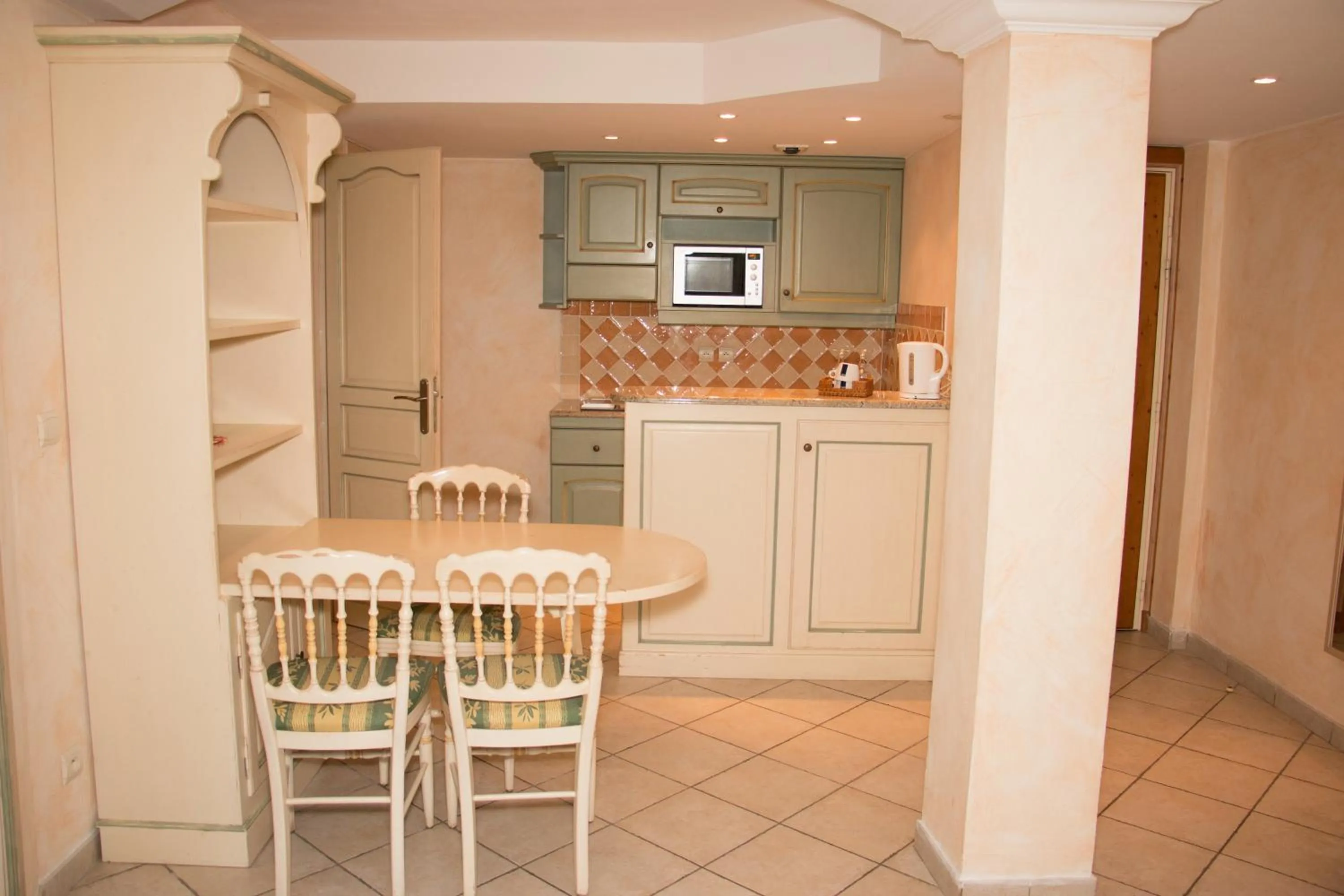 Kitchen or kitchenette in Hôtel & Spa La Villa