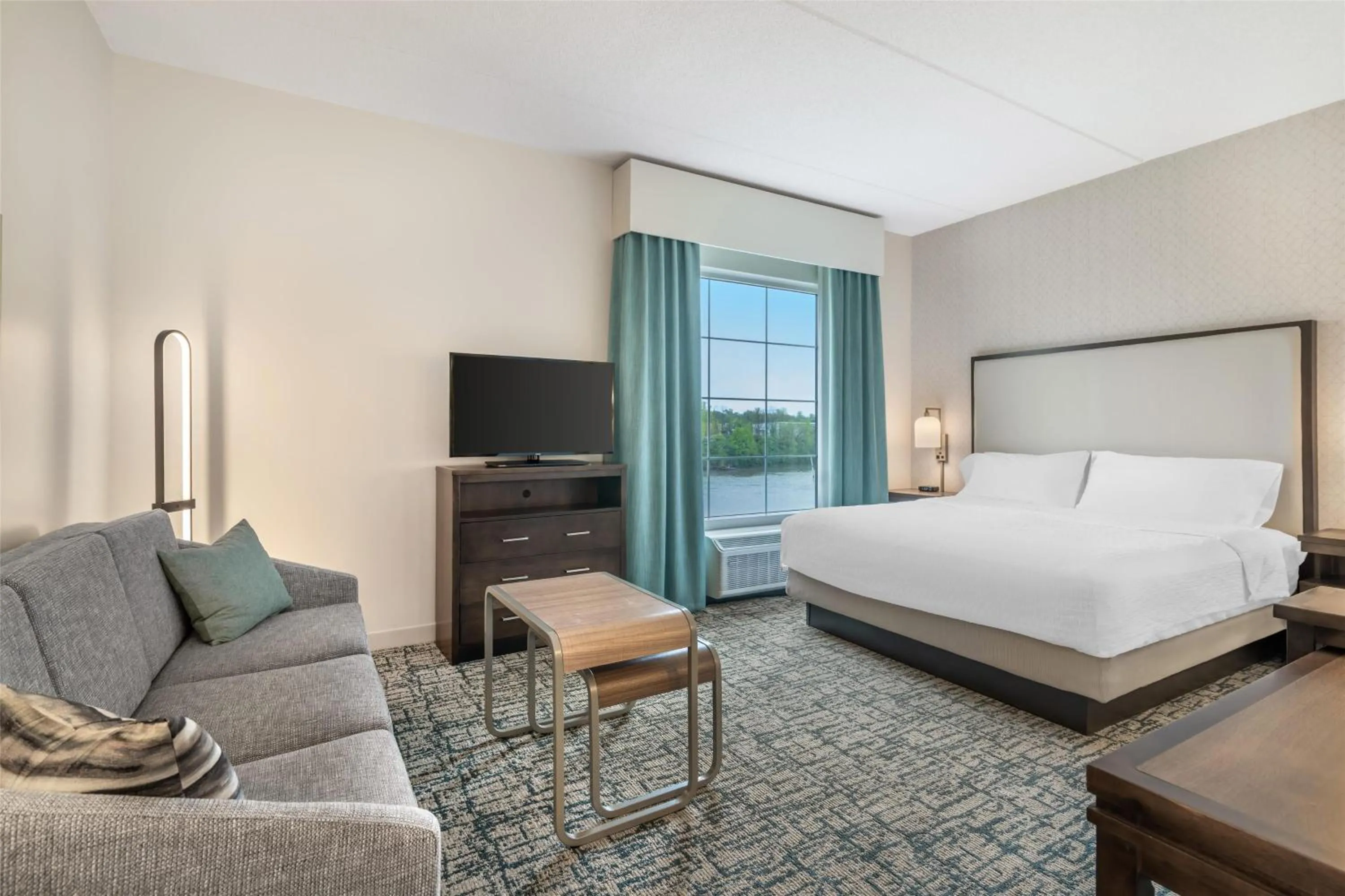 Living room, Bed in Homewood Suites By Hilton Schenectady