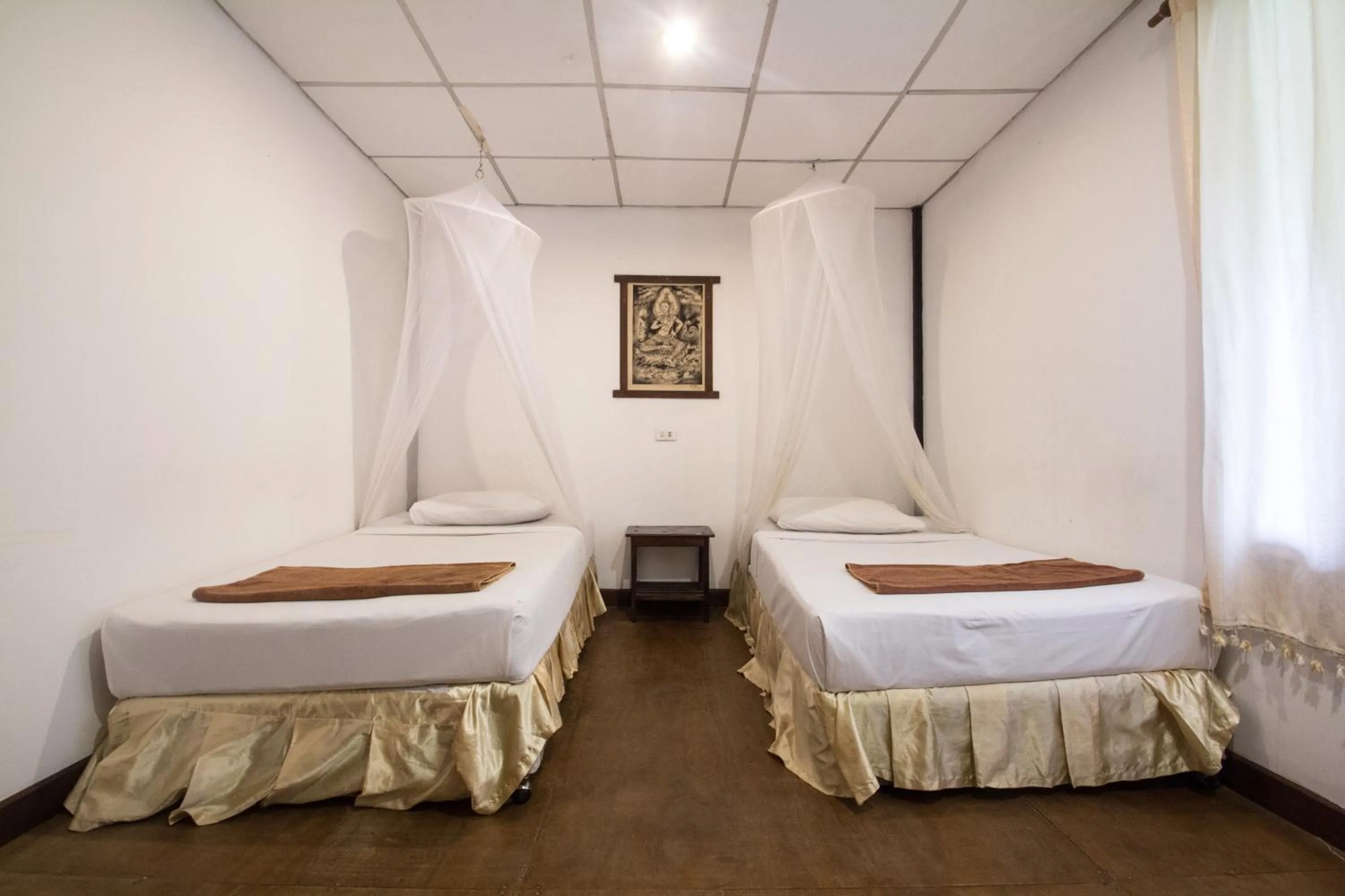 Bed in Tropical Garden Bungalow