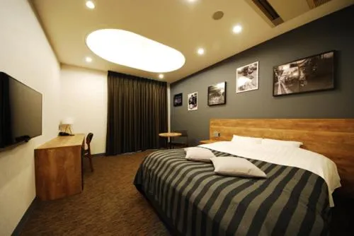 Bed in Hotel cooju Fukui