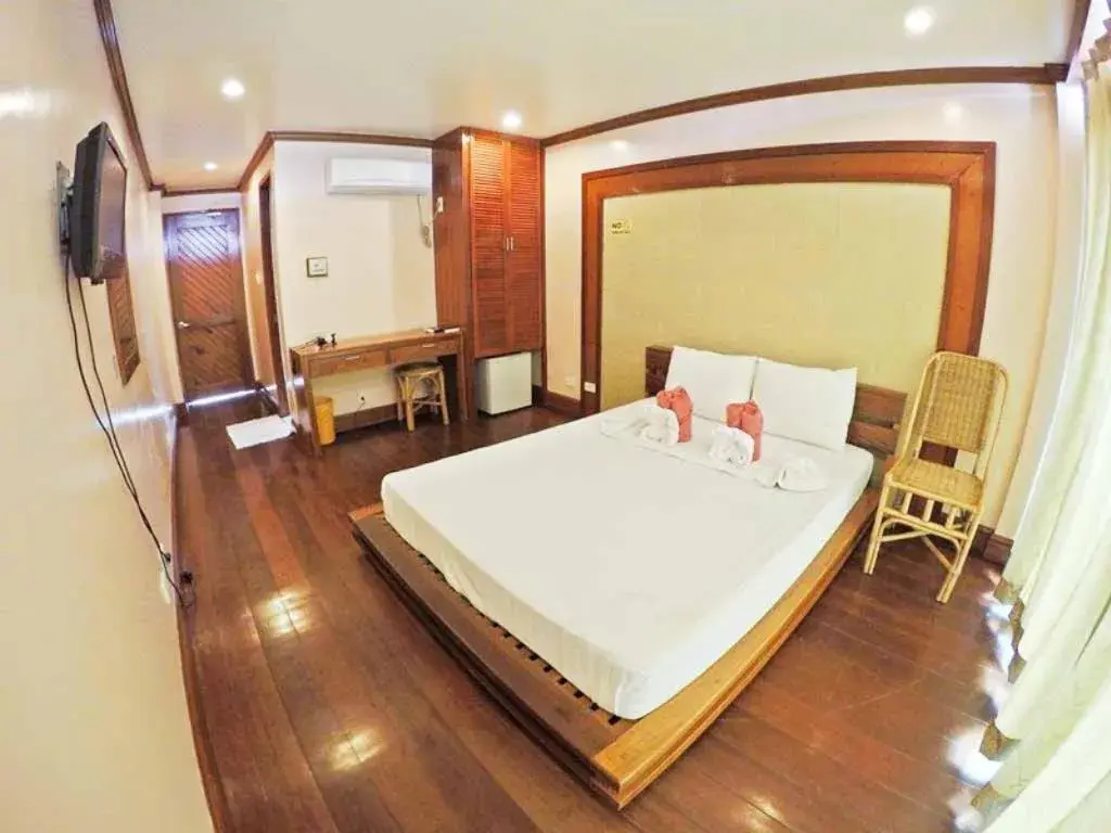 Balcony/Terrace, Bed in El Nido Beach Hotel Balcony/Terrace, Bed in El Nido Beach Hotel