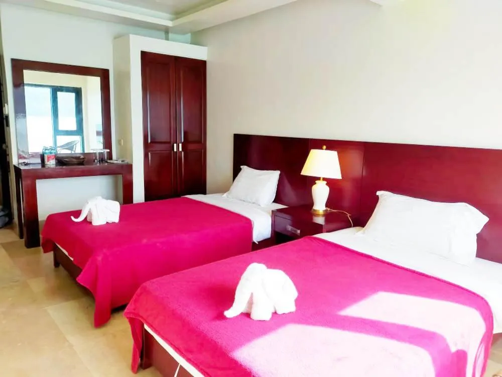 Photo of the whole room, Bed in El Nido Beach Hotel