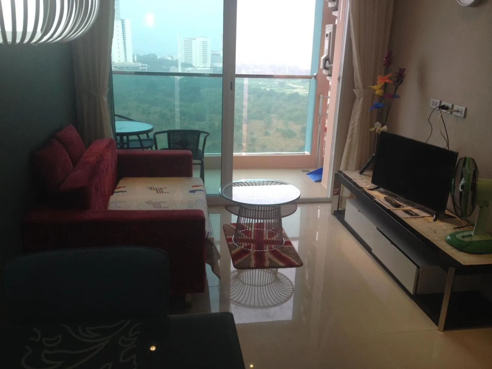 Living room in Grande Caribbean Resort 17th floor by Bell-Turner