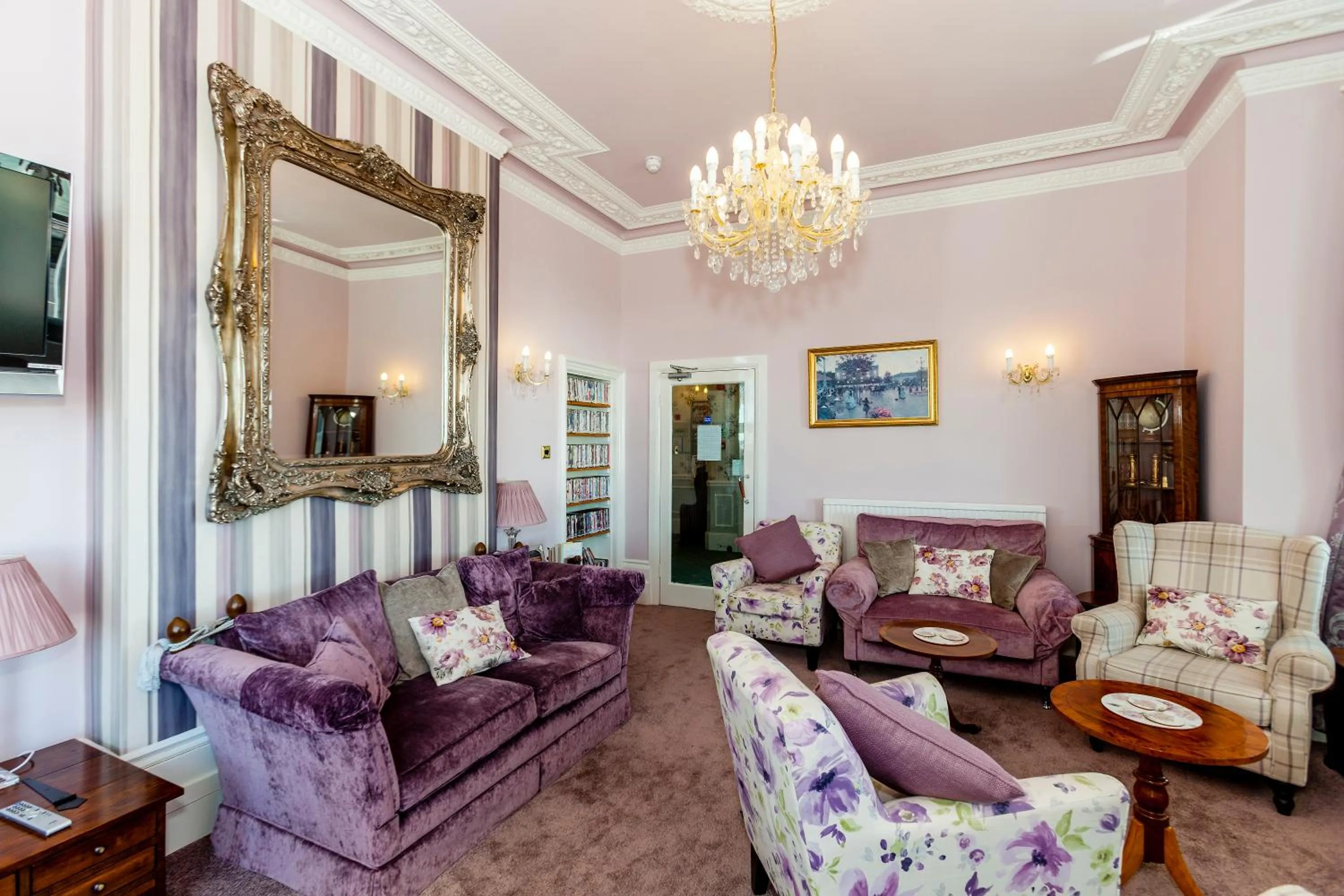 Communal lounge/ TV room in East Beach Hotel