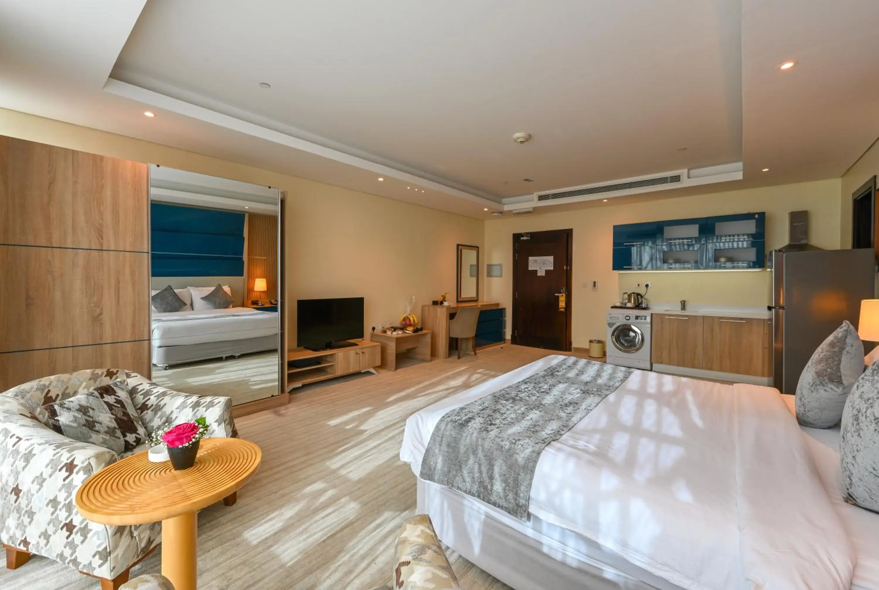 Communal lounge/ TV room, Bed in Al Mansour Suites Hotel Communal lounge/ TV room, Bed in Al Mansour Suites Hotel