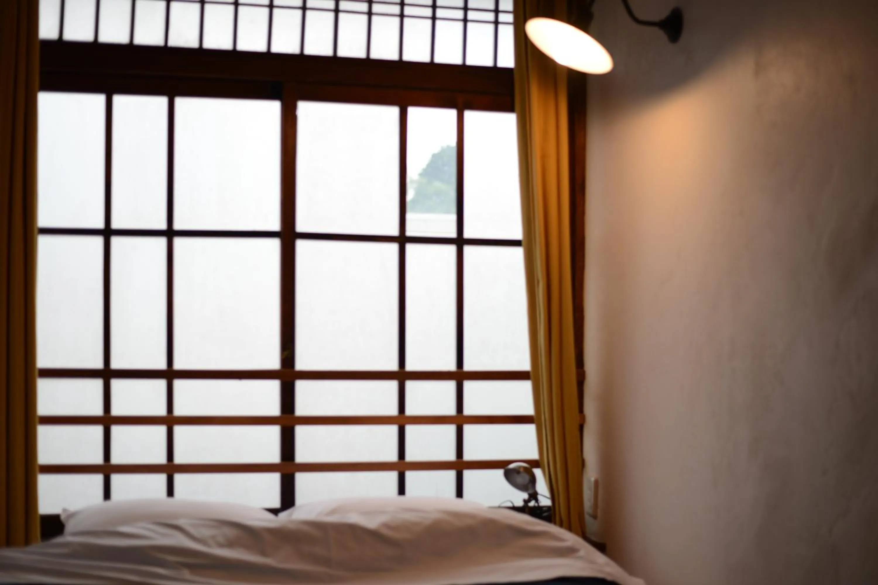 Decorative detail, Bed in Taketa Ekimae Hostel cue