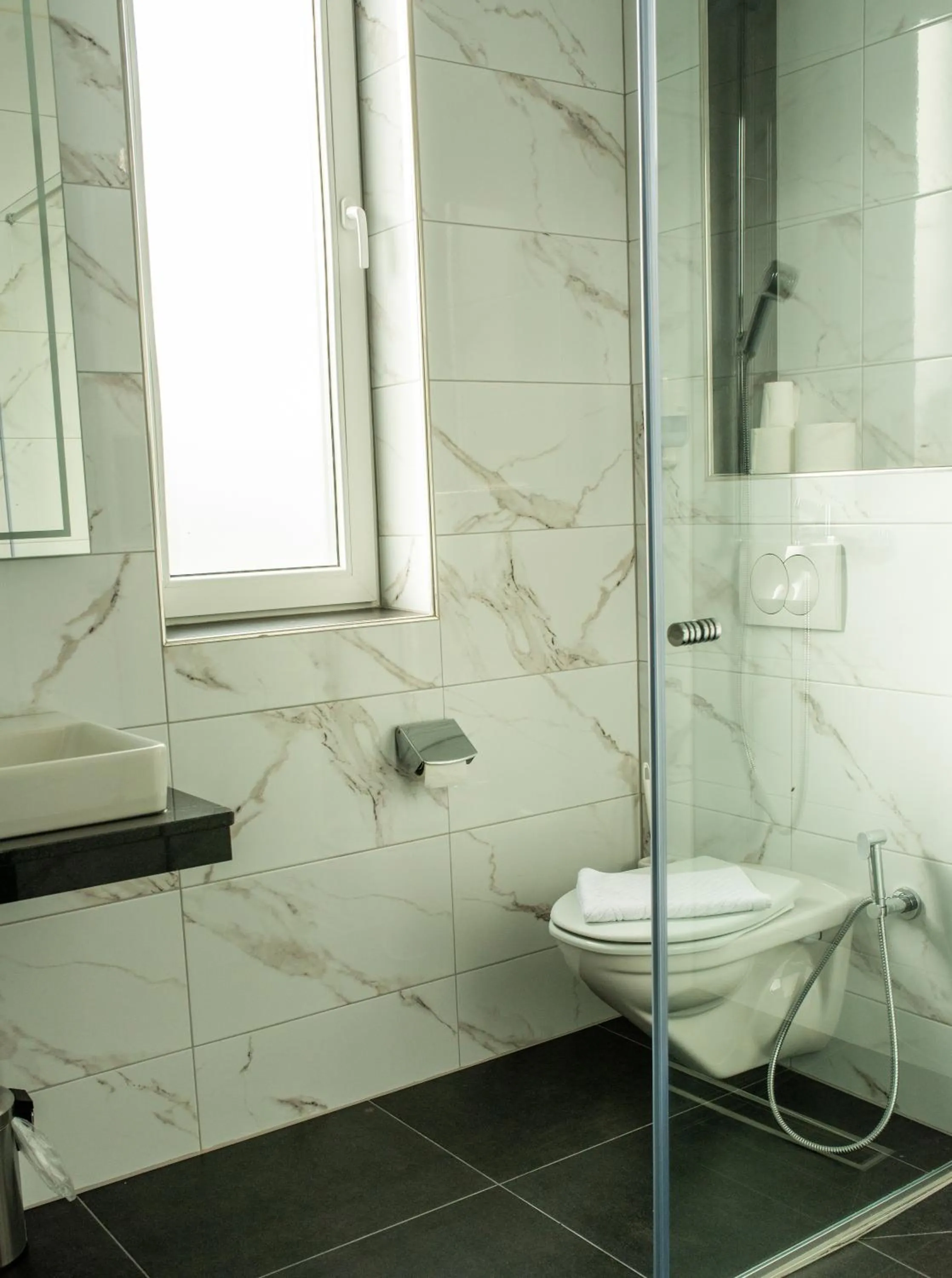 Bathroom in Swiss Plus Hotel