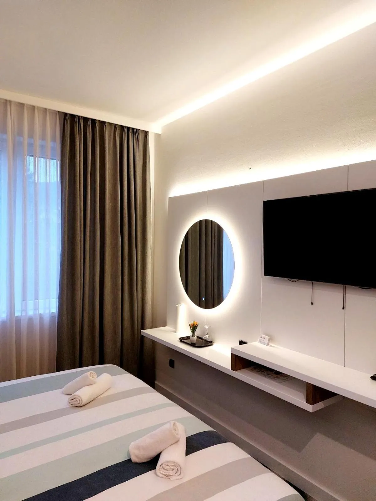Bed in Swiss Plus Hotel