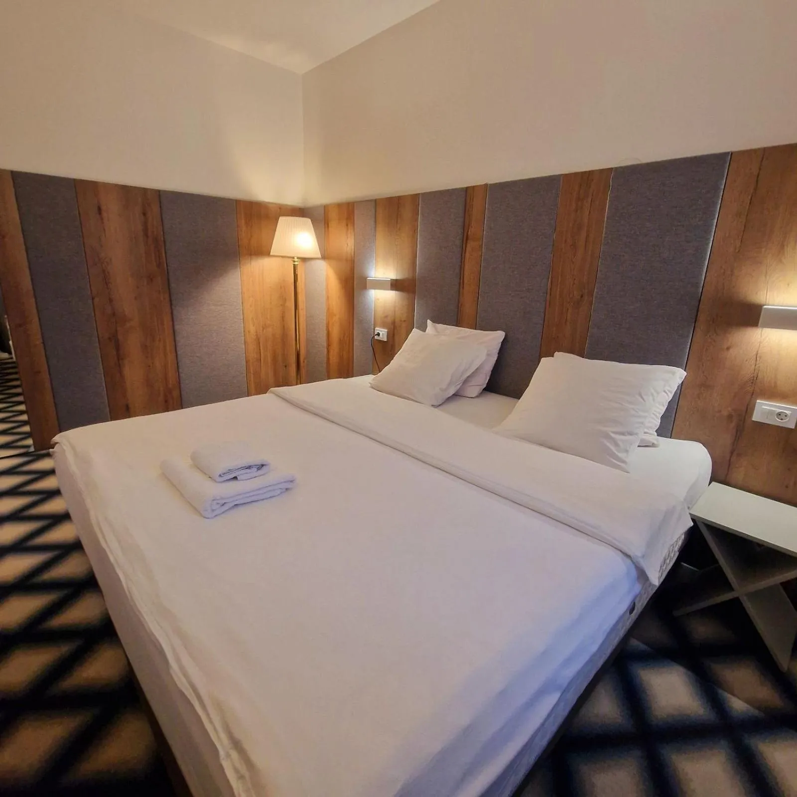 Bed in Swiss Plus Hotel