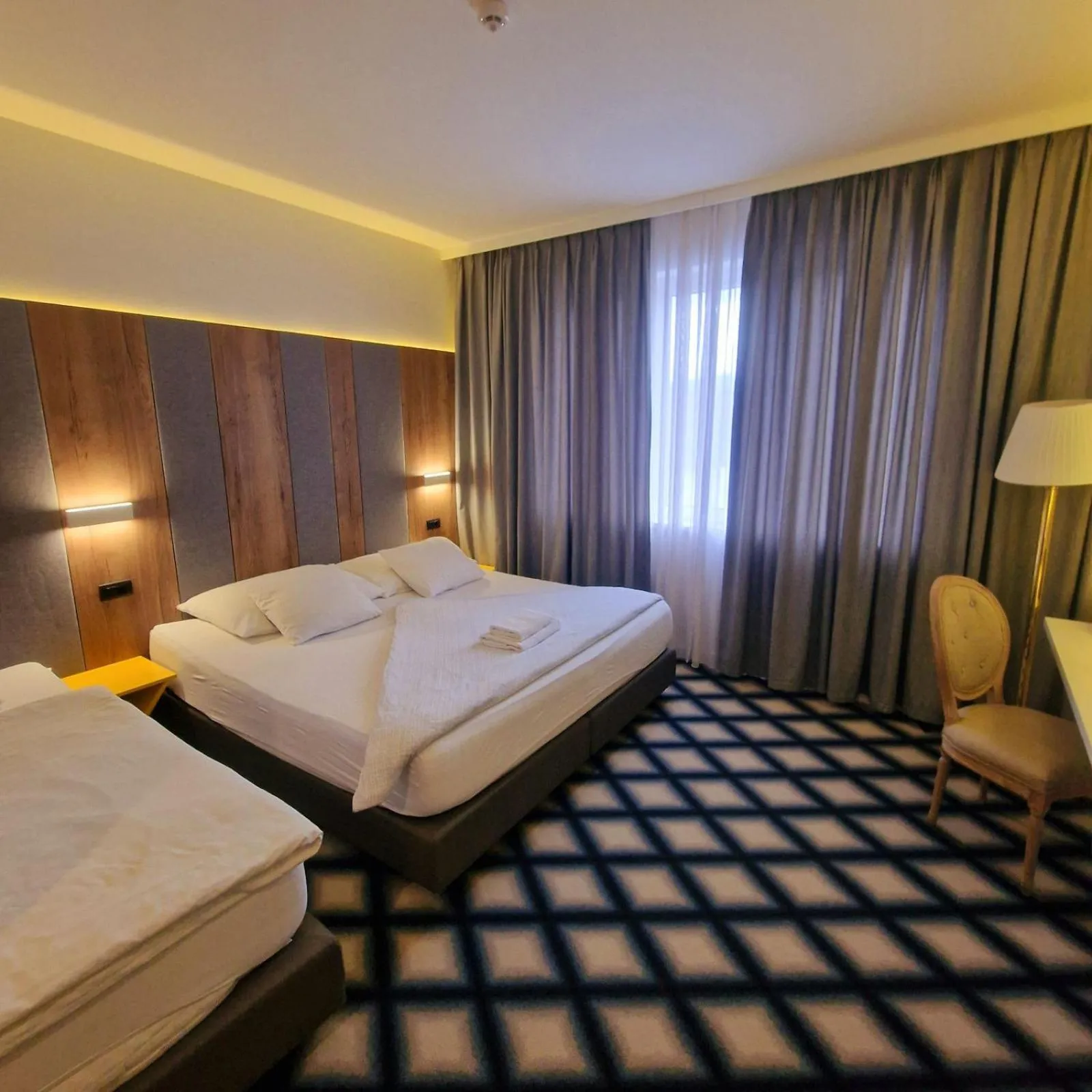 Bed in Swiss Plus Hotel