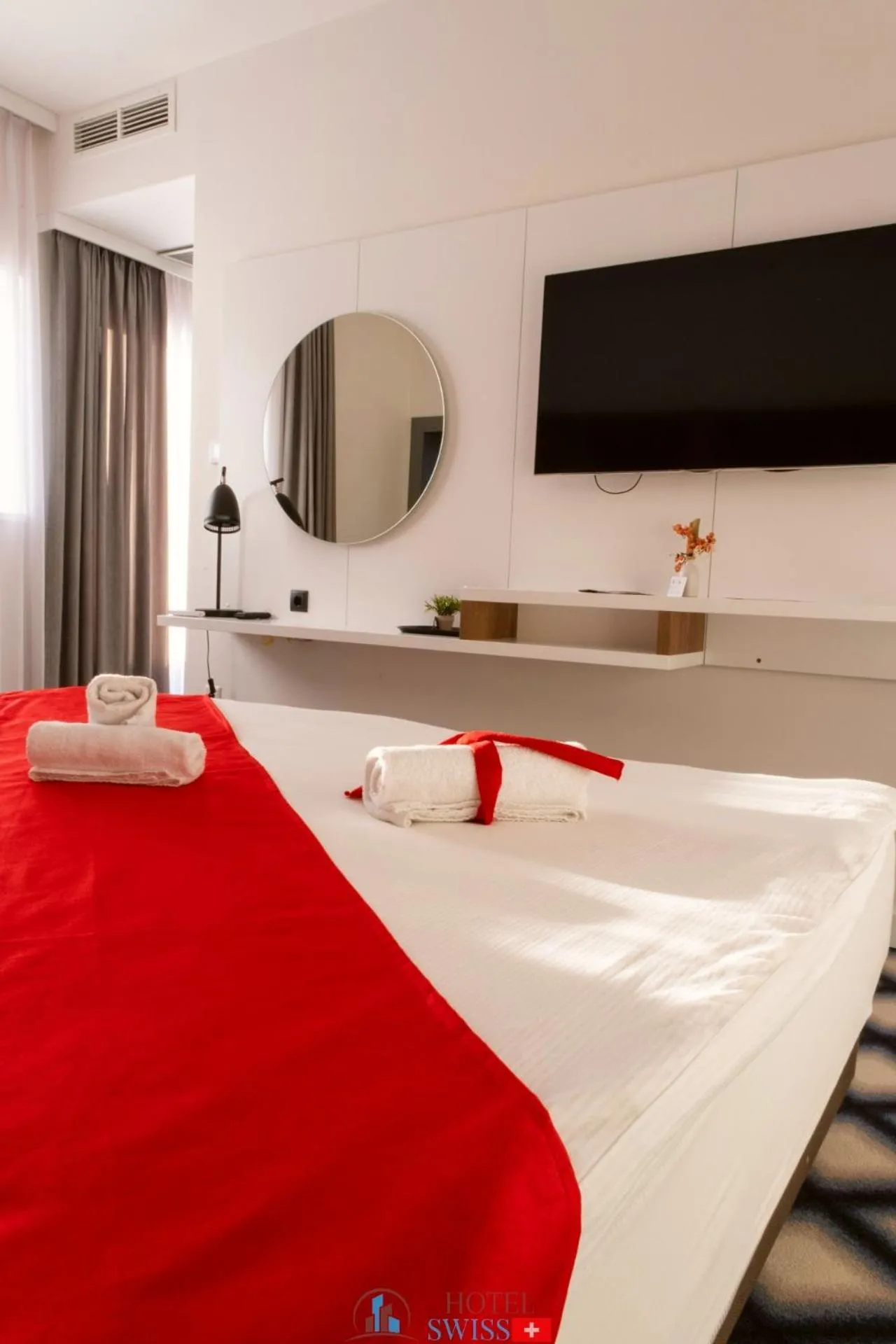 Communal lounge/ TV room in Swiss Plus Hotel