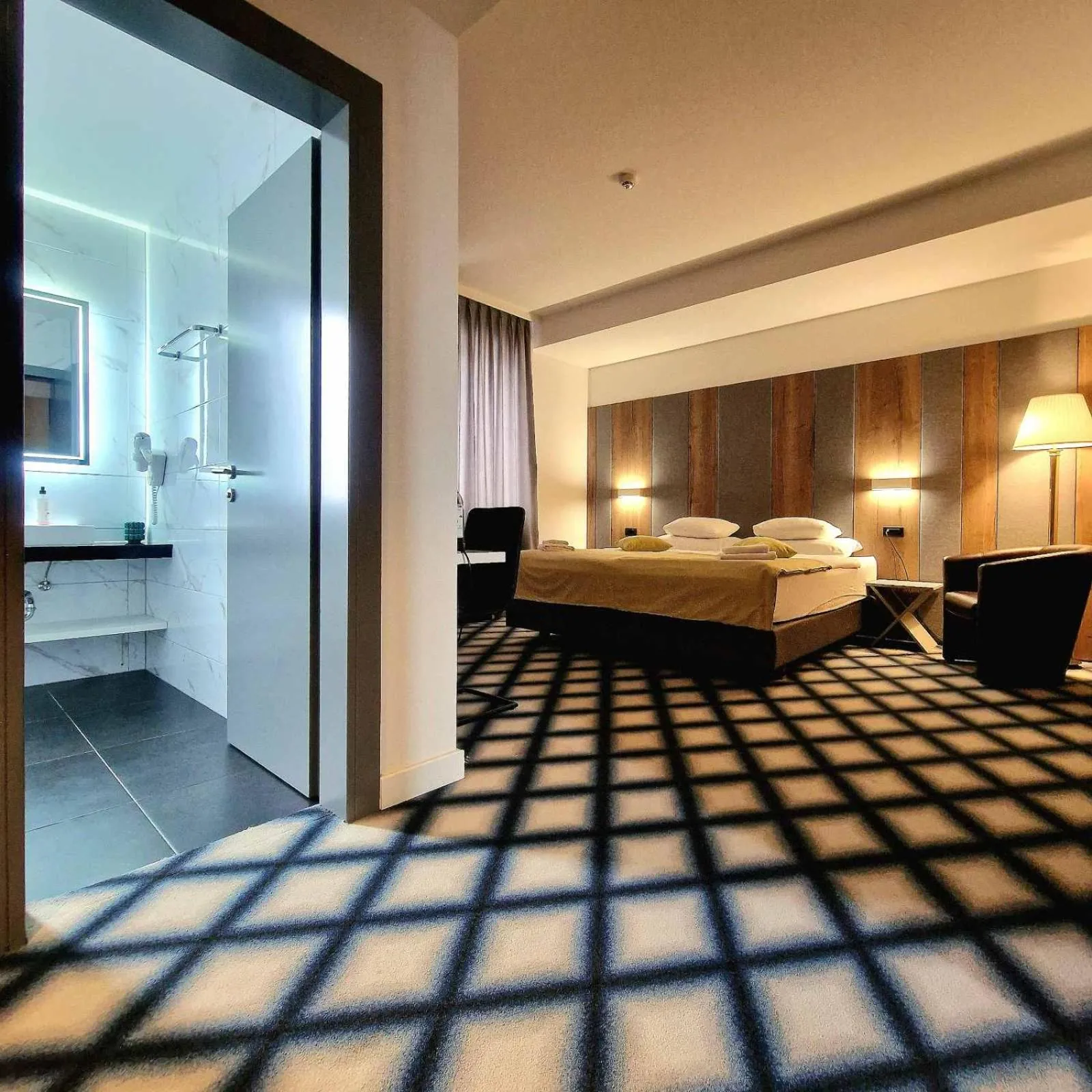 Bed in Swiss Plus Hotel