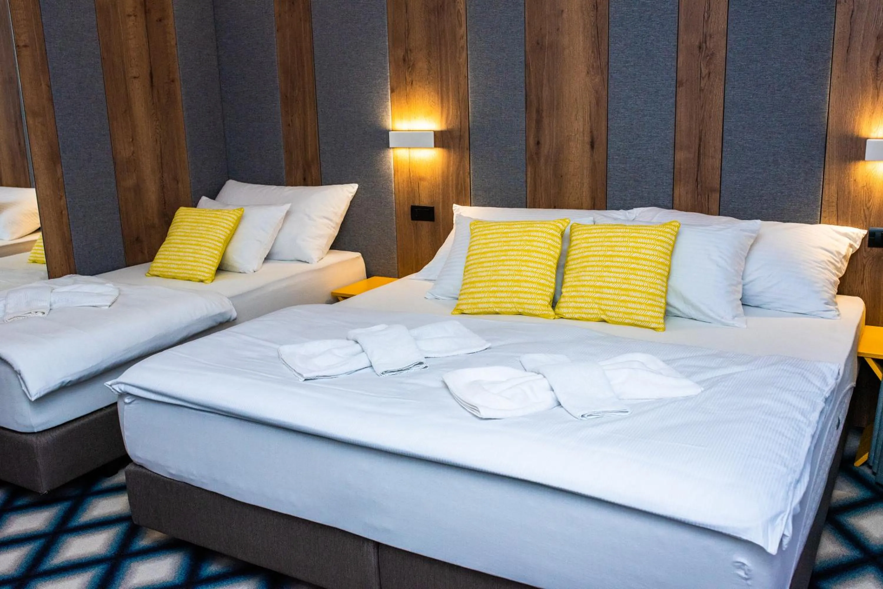 Bed in Swiss Plus Hotel