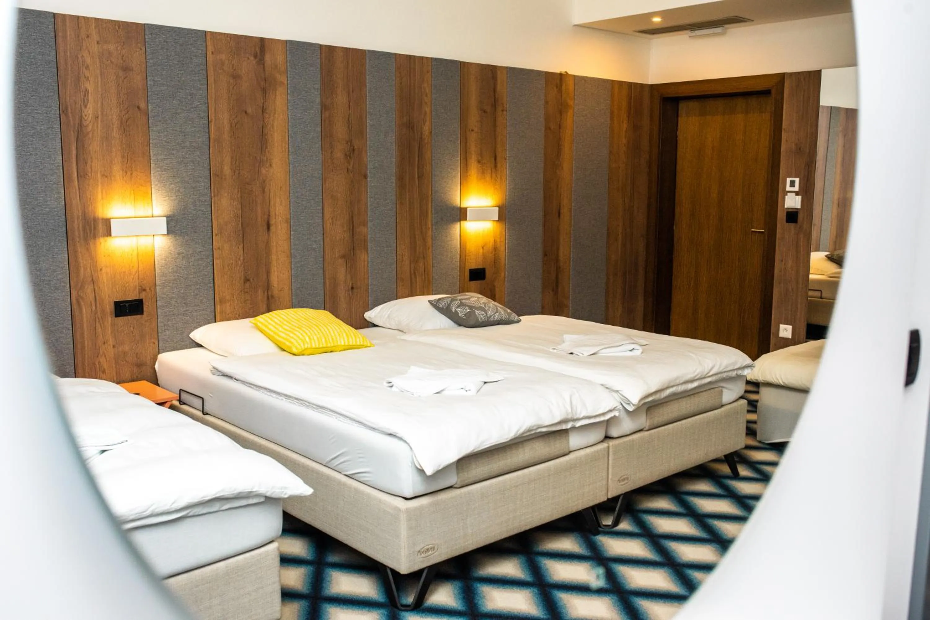 Bed in Swiss Plus Hotel