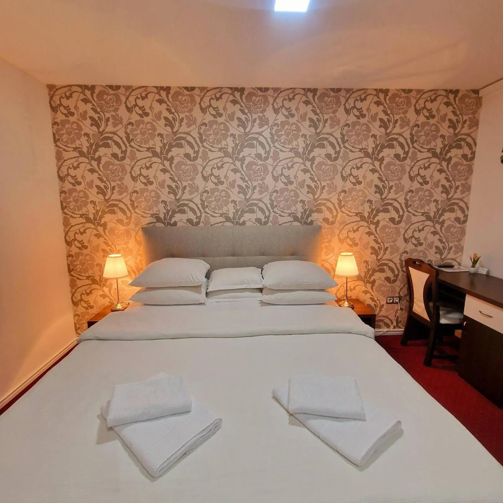 Bed in Swiss Plus Hotel