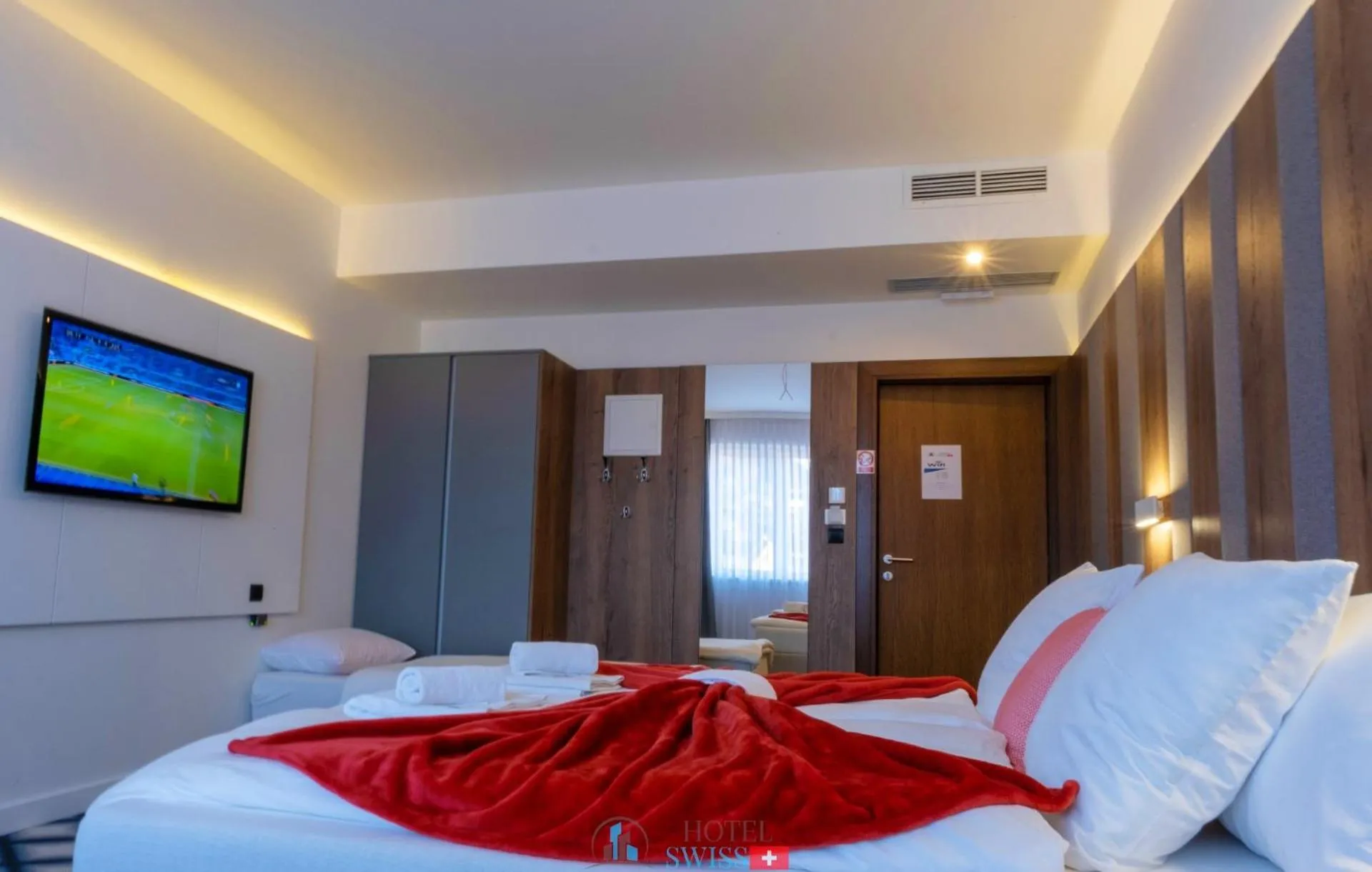Photo of the whole room, Bed in Swiss Plus Hotel