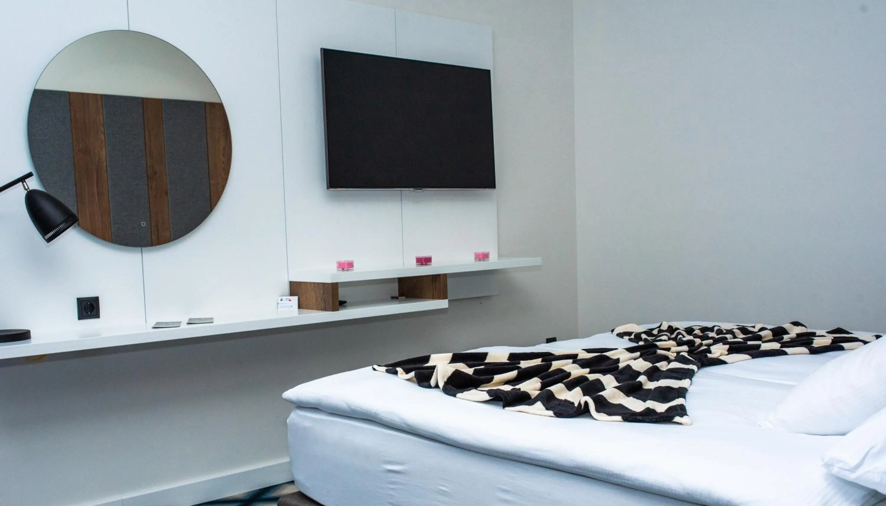 Bed in Swiss Plus Hotel