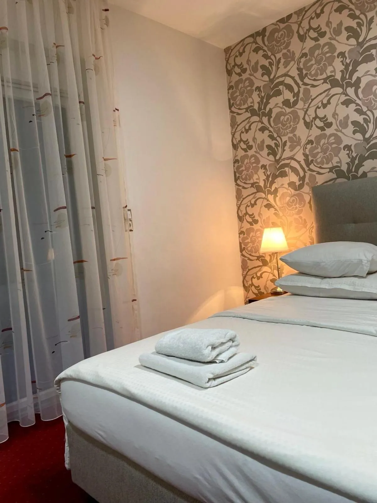 Bed in Swiss Plus Hotel