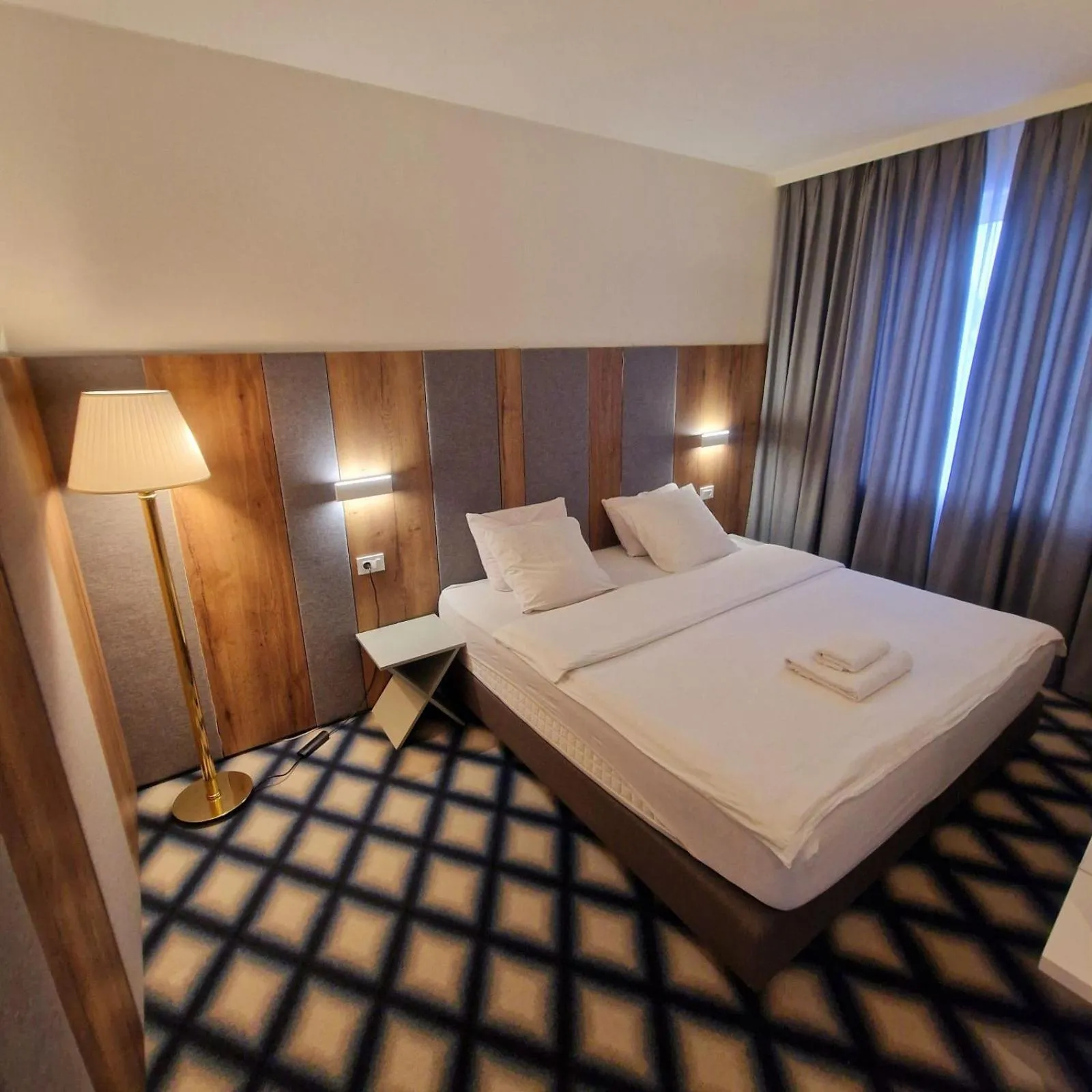 Bed in Swiss Plus Hotel