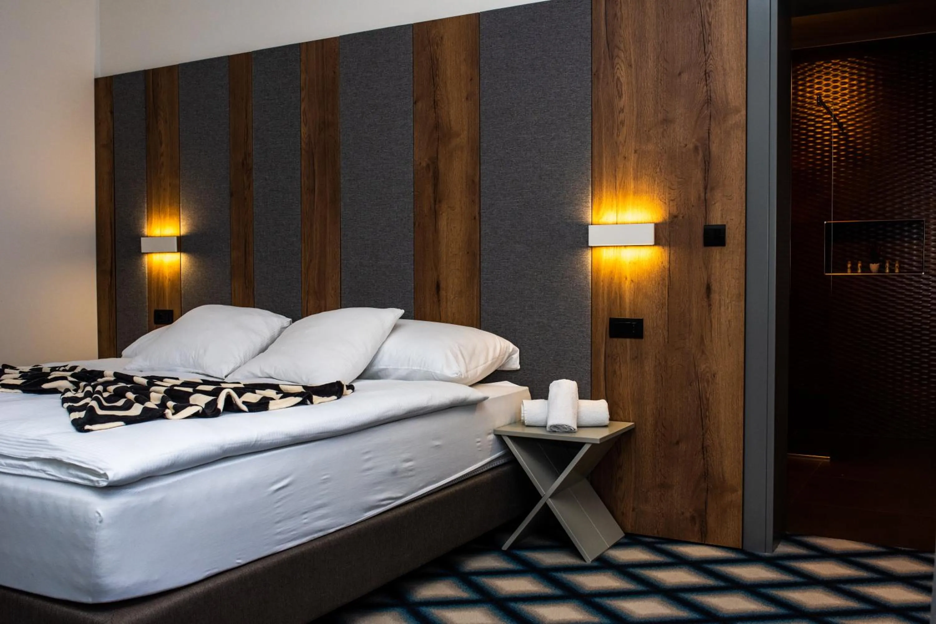 Bed in Swiss Plus Hotel