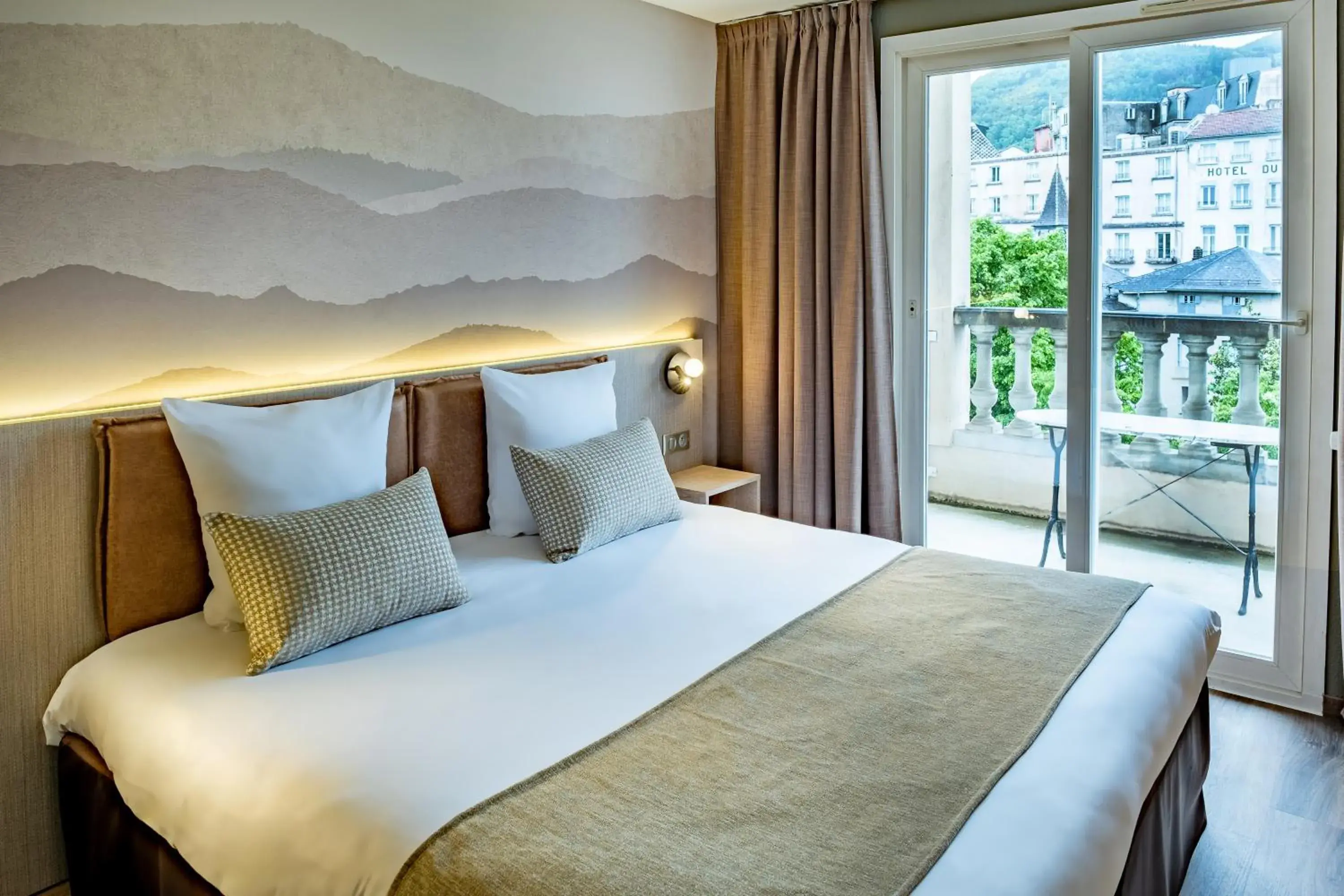 View (from property/room), Bed in Hôtel La Solitude View (from property/room), Bed in Hôtel La Solitude