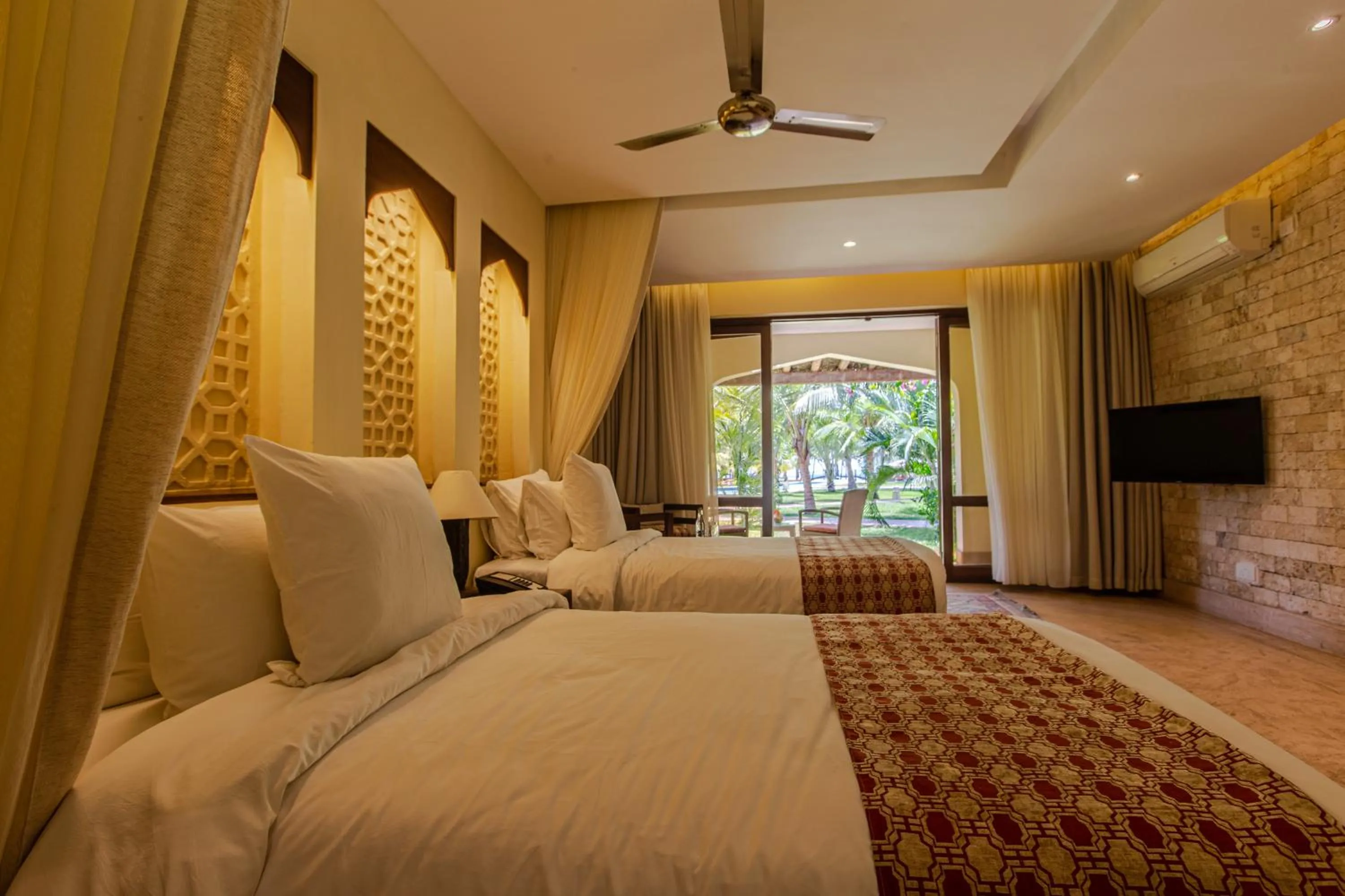 Bed in Silver Palm Spa & Resort