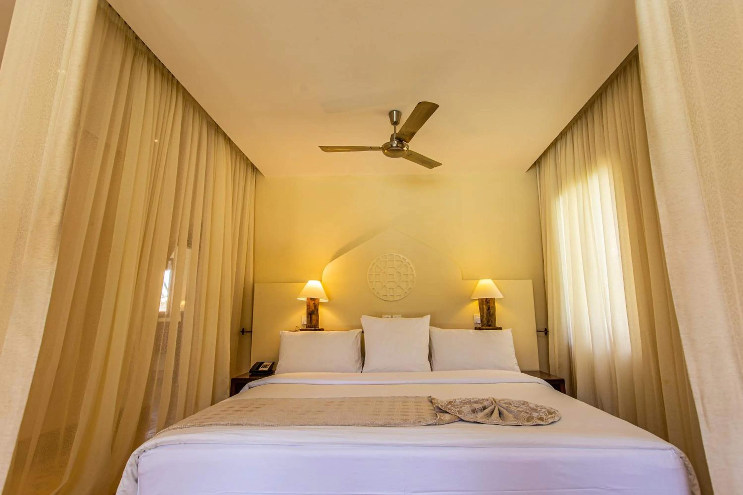 Bed in Silver Palm Spa & Resort