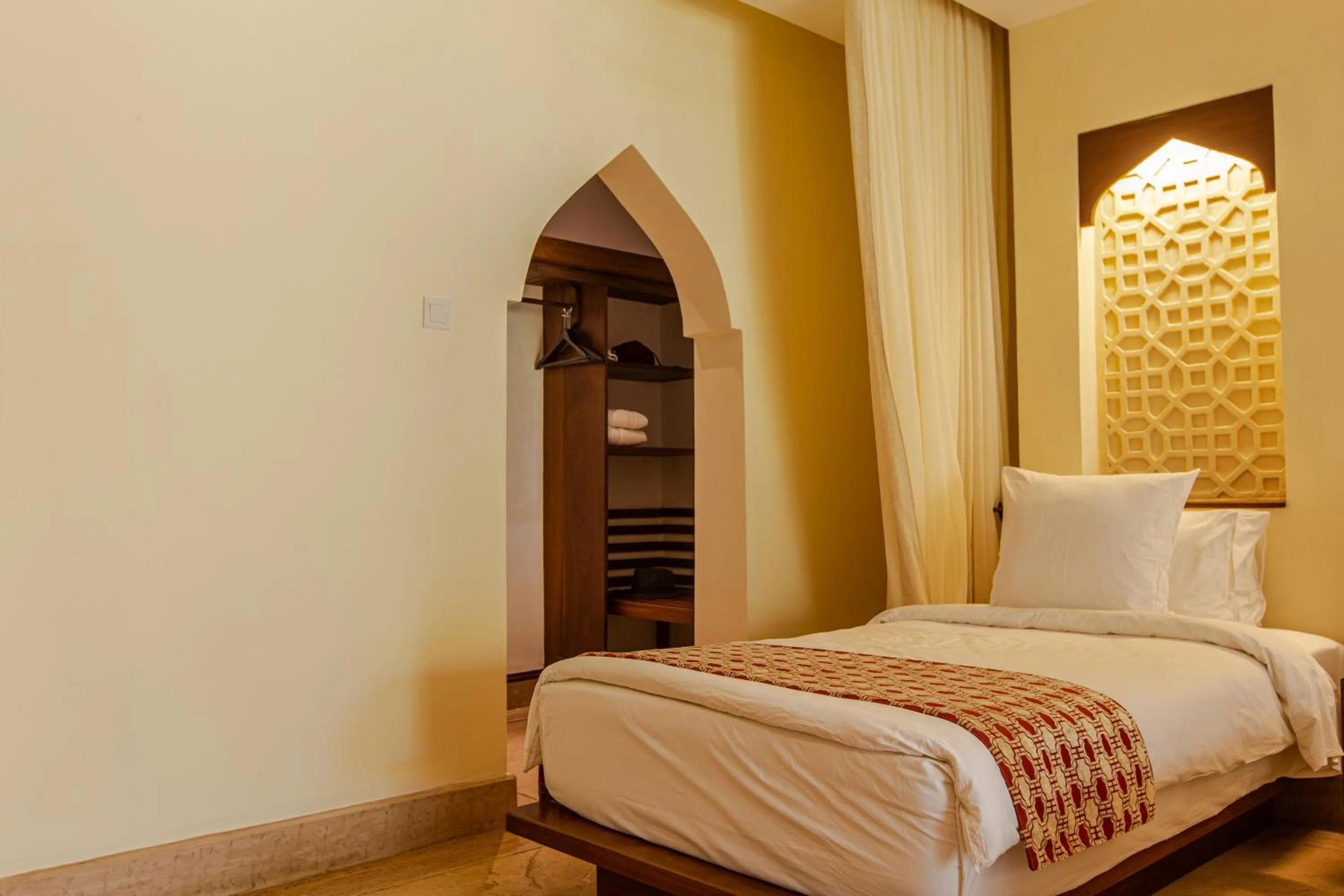 Bed in Silver Palm Spa & Resort