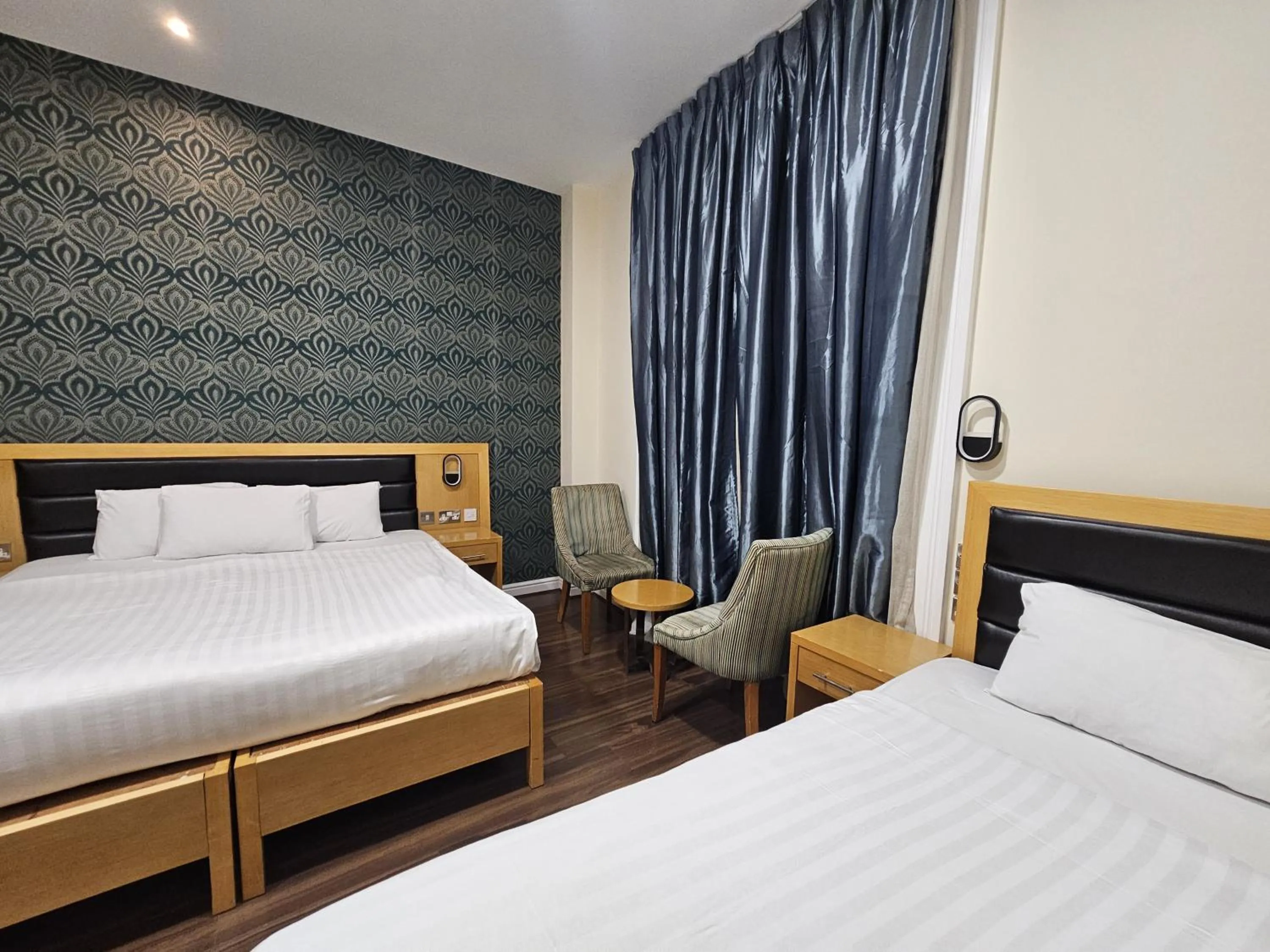 Bed in Cromwell Hotel