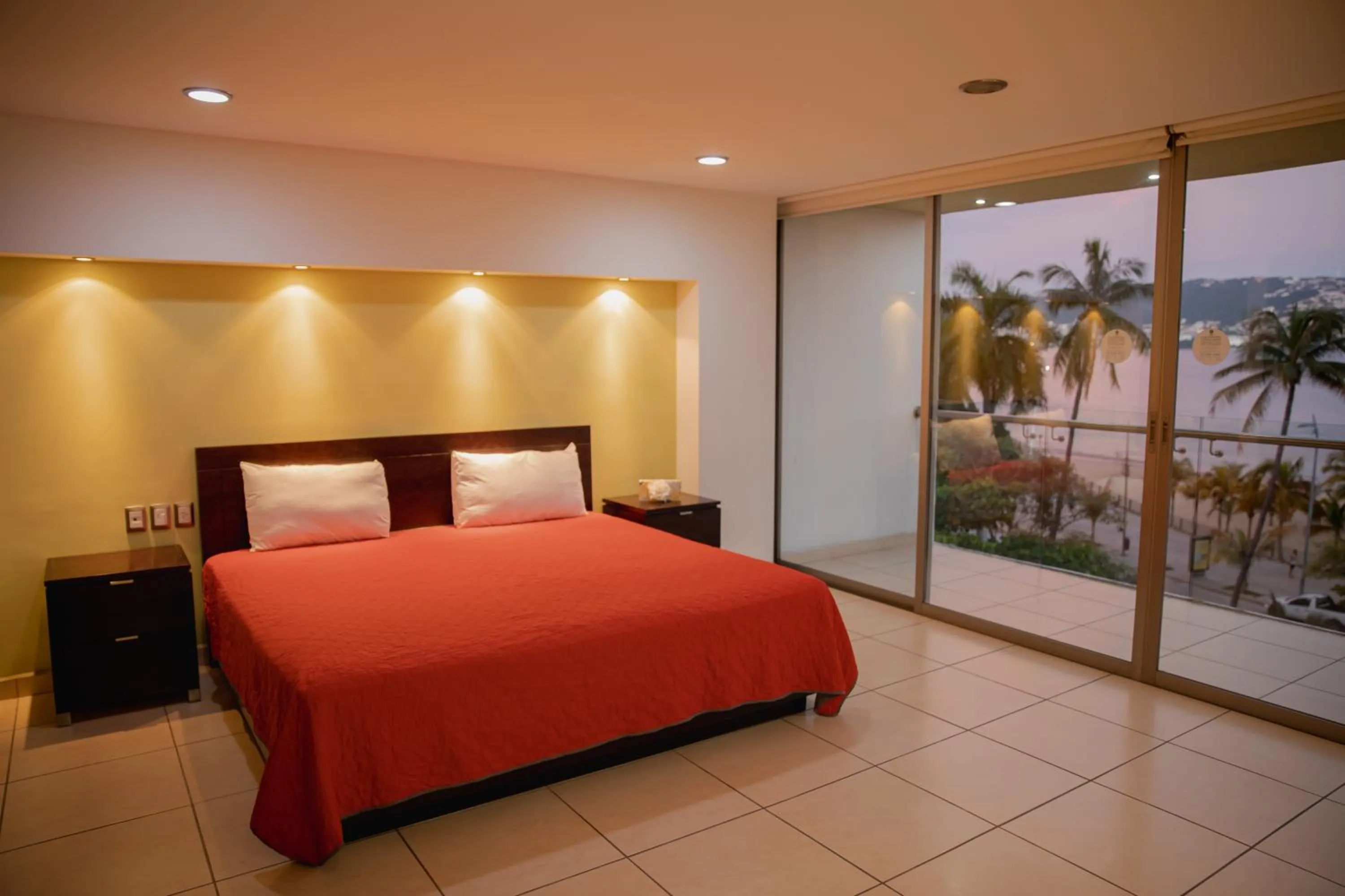 Photo of the whole room, Bed in Ramada by Wyndham Acapulco Hotel & Suites