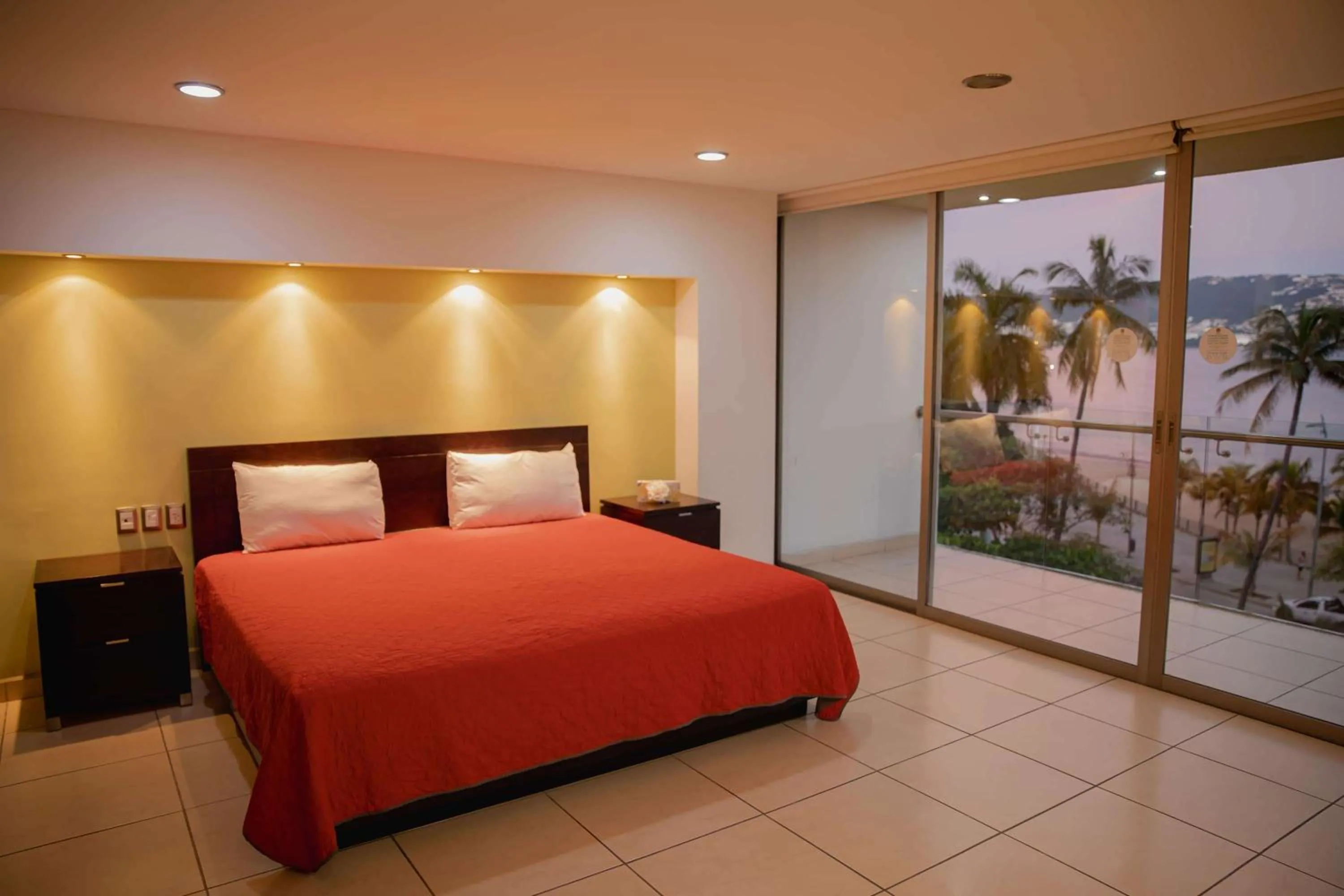 Photo of the whole room, Bed in Ramada by Wyndham Acapulco Hotel & Suites