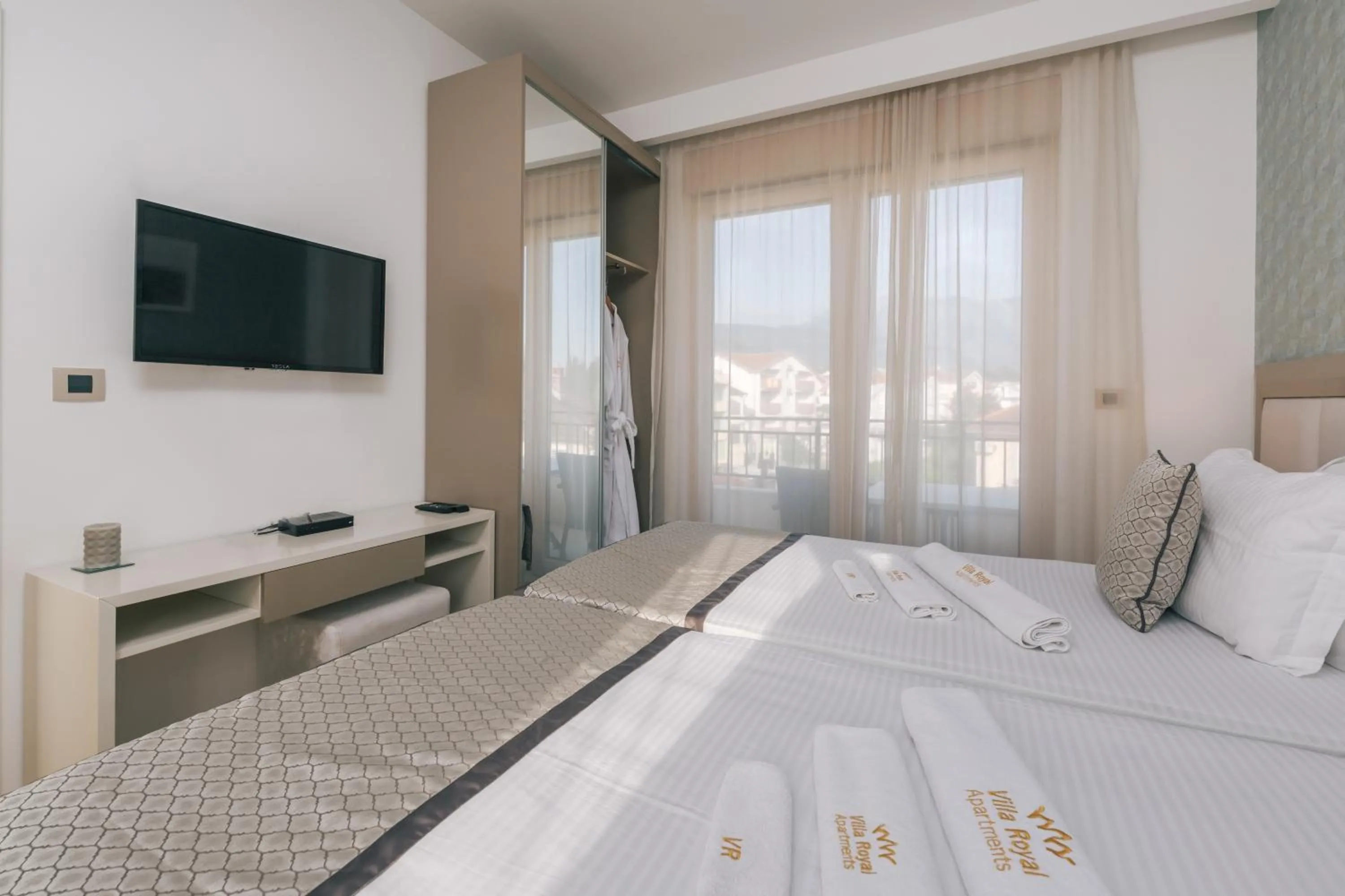 Bed in Villa Royal Apartments