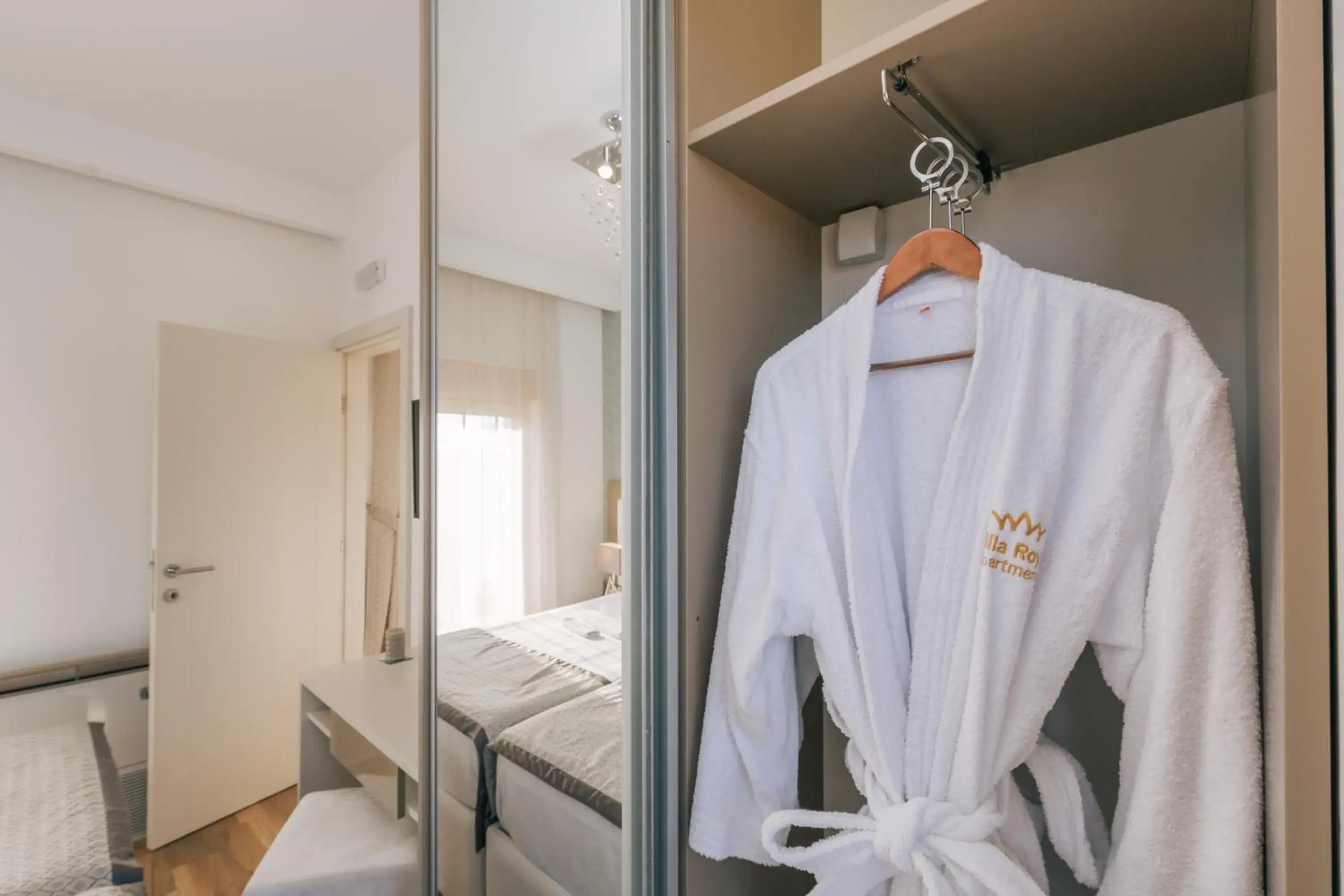 Property logo or sign, Bed in Villa Royal Apartments Property logo or sign, Bed in Villa Royal Apartments