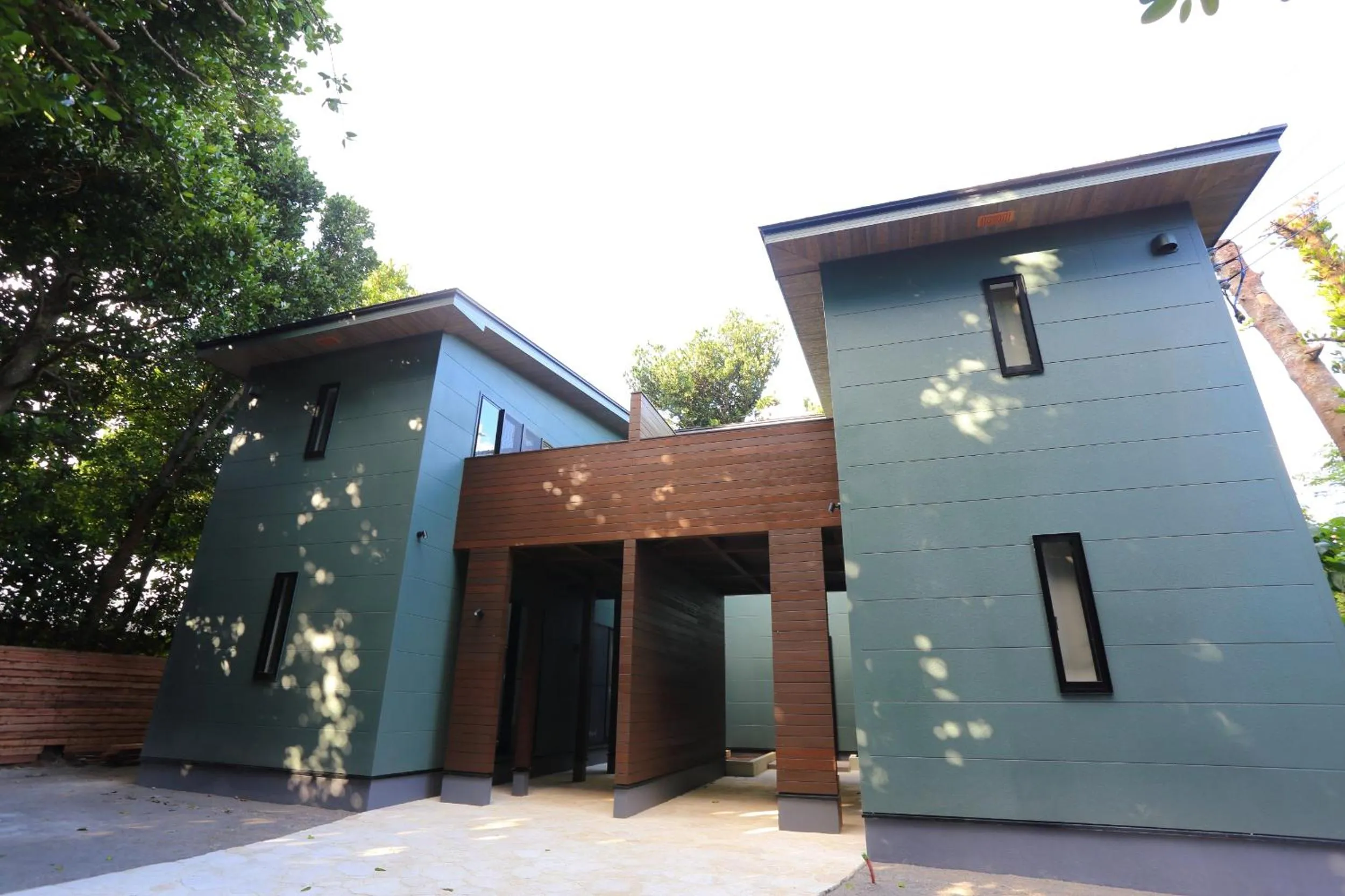 Facade/entrance in Tabinoteitaku Okinawa Bise HOMANN CONCEPT