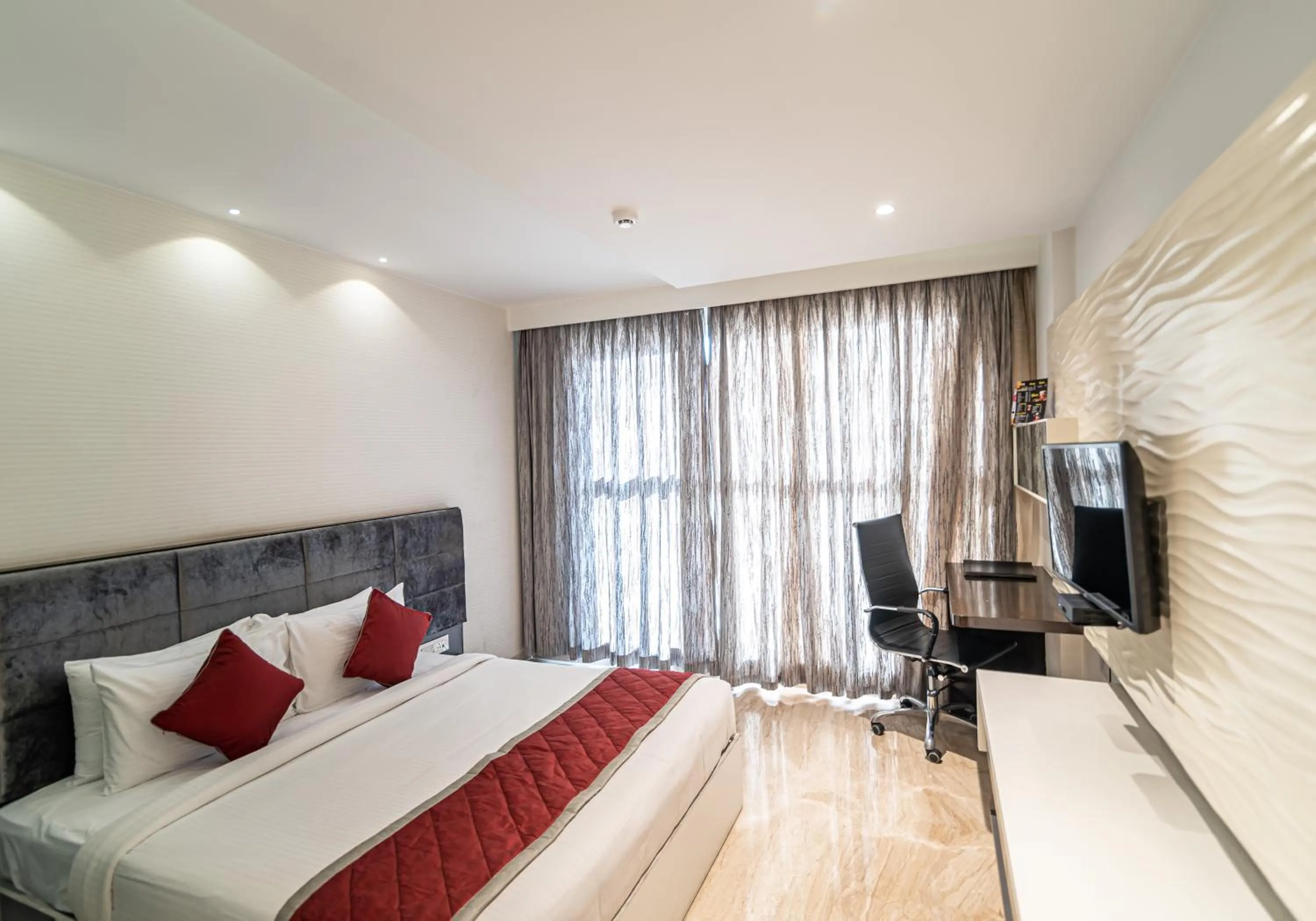 Bed in Bhagini Icon Premier Hotel