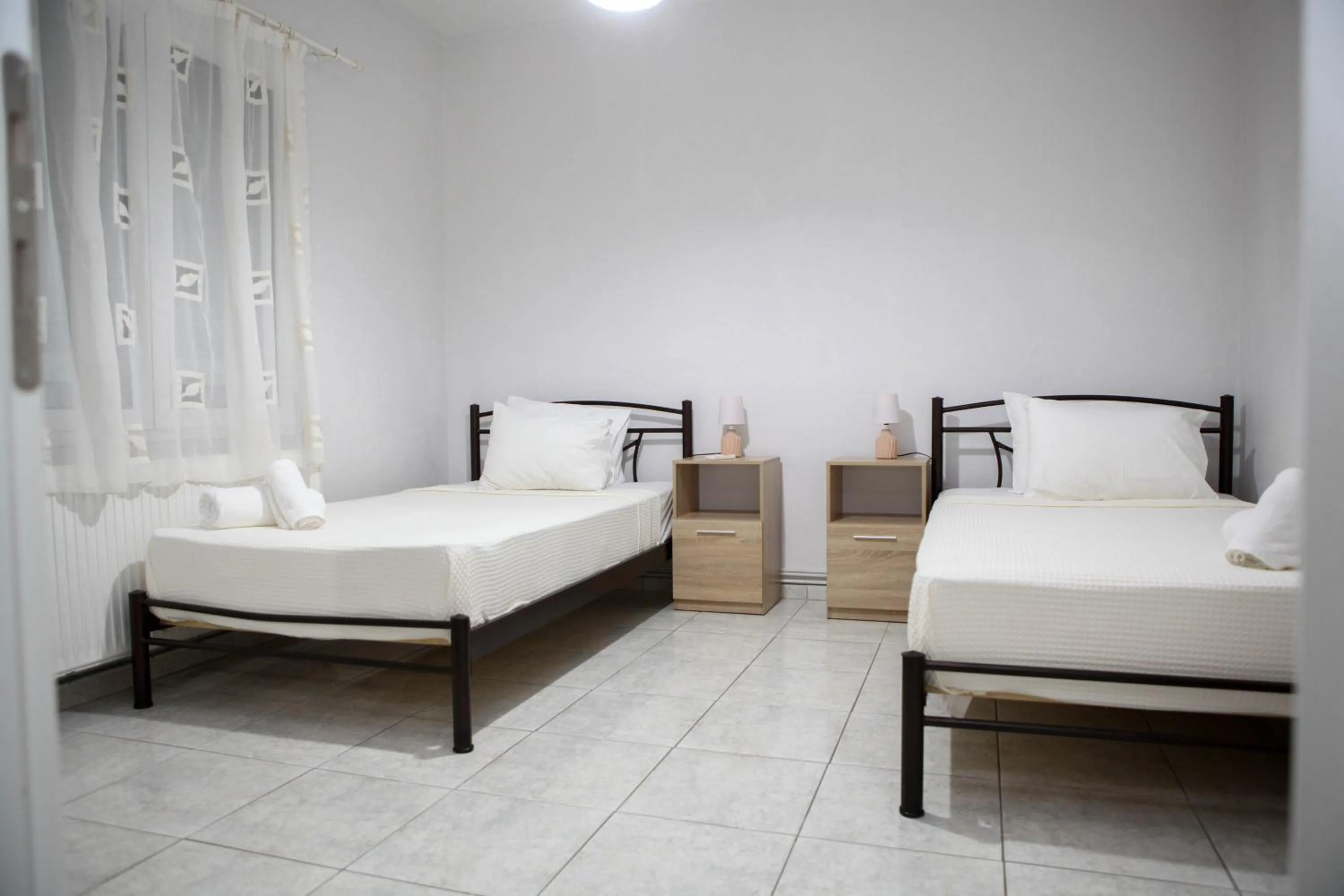 Bed in Nicole Fresh Apartments