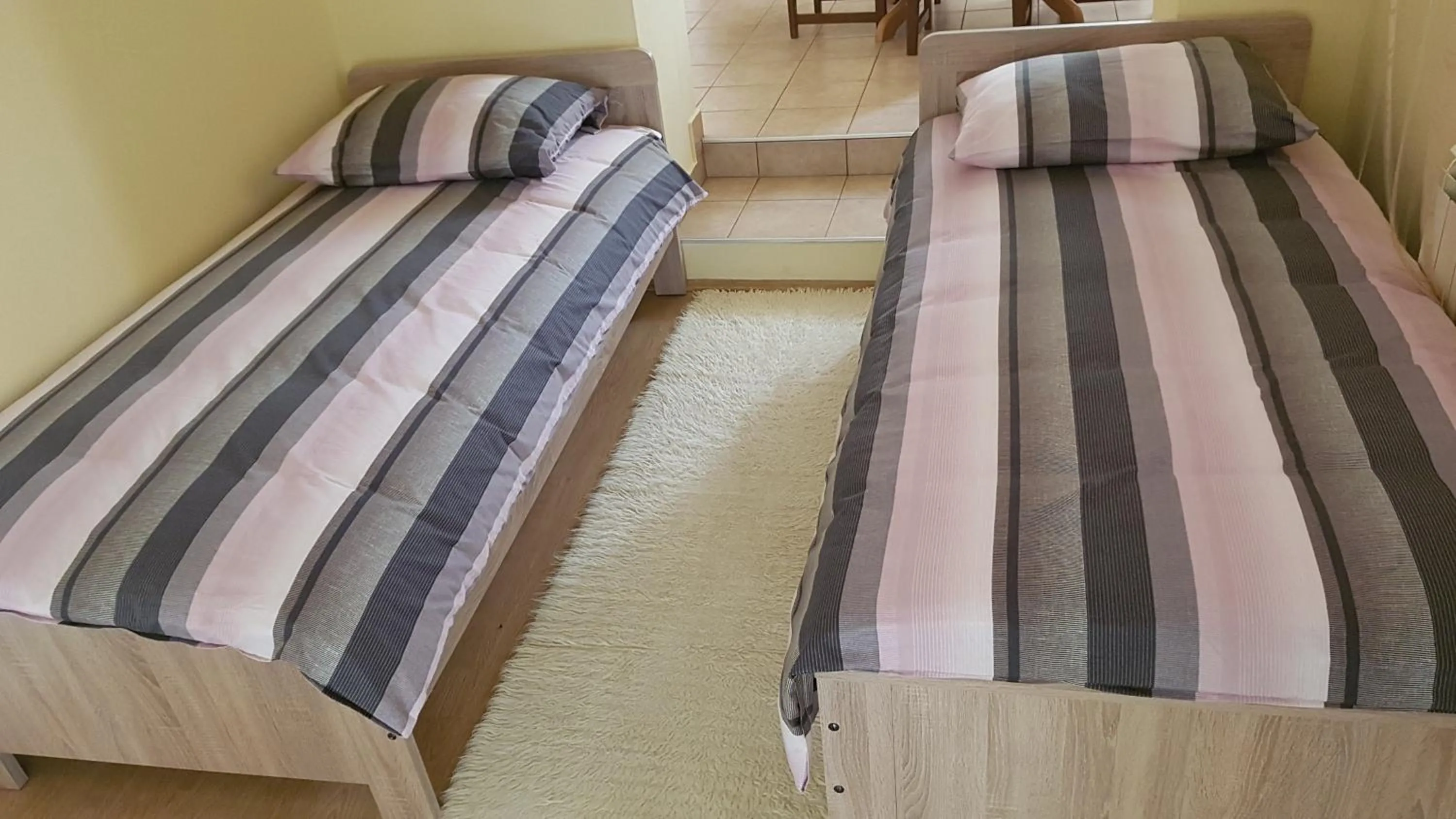 Bed in Apartment Nika